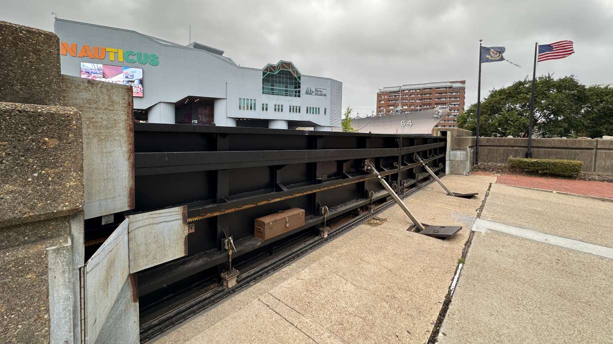 A flood gate blocks Main Street from the waterfront in Norfolk, Va., as a nor'easter works its way up the coast, Thursday, Sept. 24, 2026.