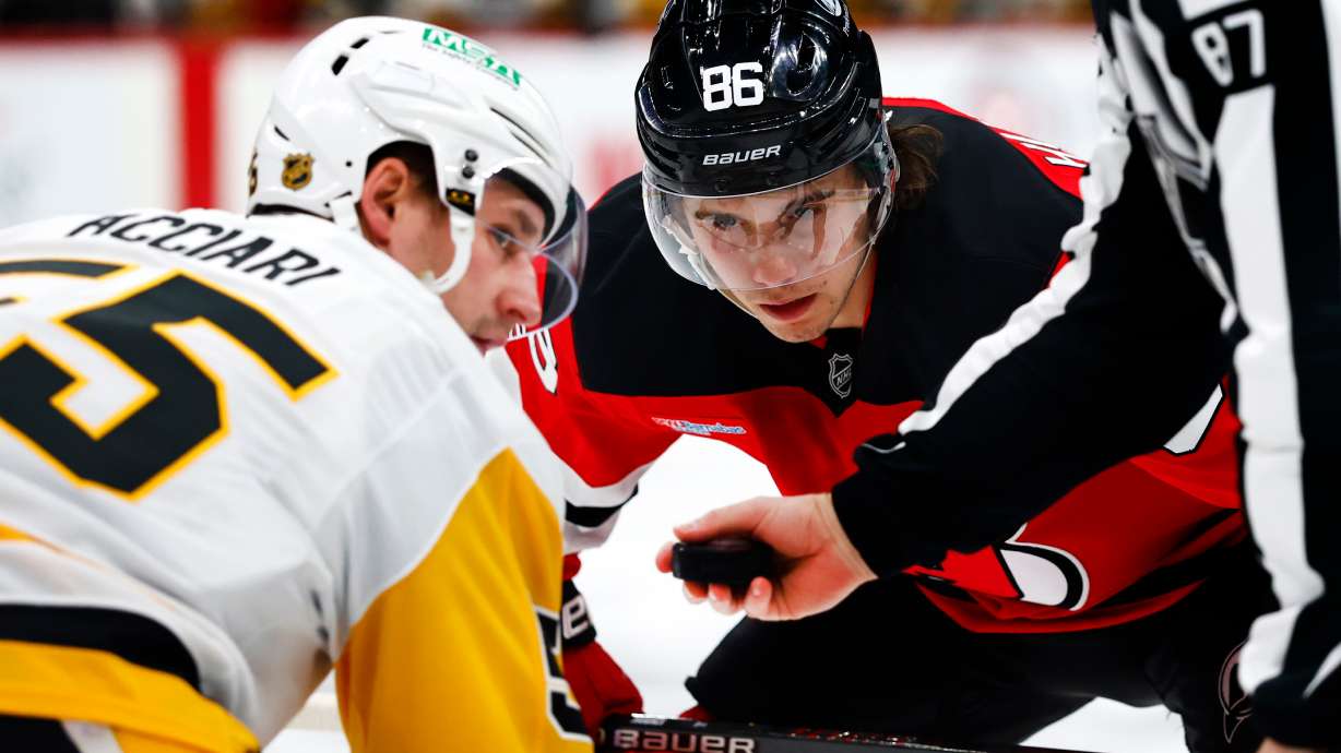 FILE - New Jersey Devils center Jack Hughes (86) before a face off against Pittsburgh Penguins center Noel Acciari (55) during the second period of an NHL hockey game, April 9, 2026, in Newark, N.J.