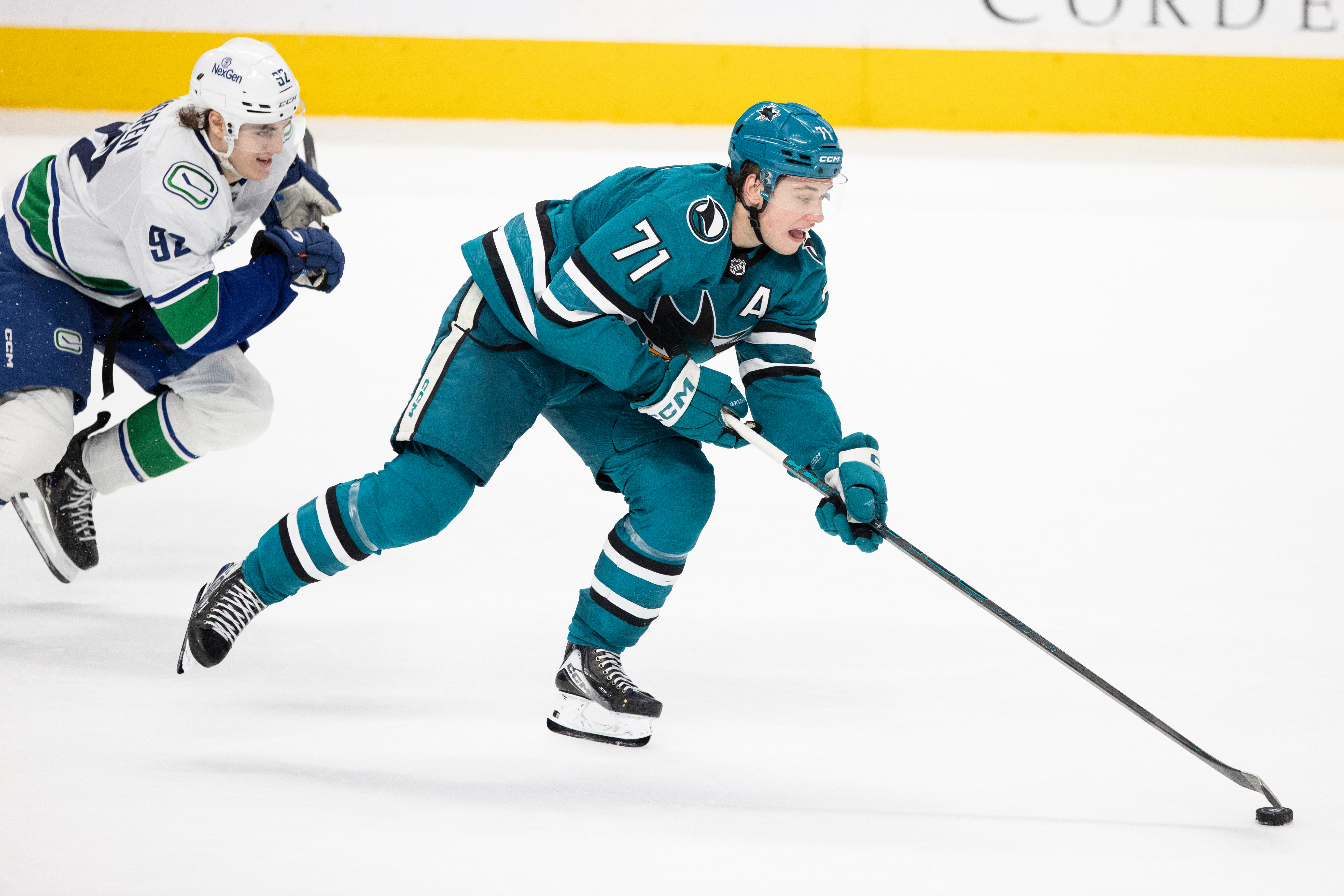FILE - San Jose Sharks center Macklin Celebrini (71) drives the puck as Vancouver Canucks left wing Liam Ohgren (92) defends during the third period of their NHL ice hockey game in San Jose, Calif., Saturday, April 11, 2026. 