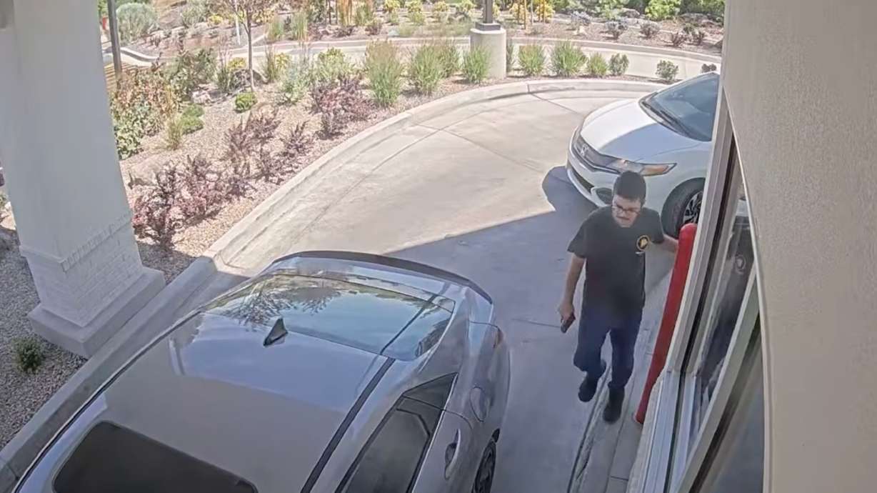 This image taken from video provided by the Twin Falls Police Department shows Chad Williams holding a gun and approaching a car in an In-N-Out drive-thru Aug. 1, in Twin Falls, Idaho.