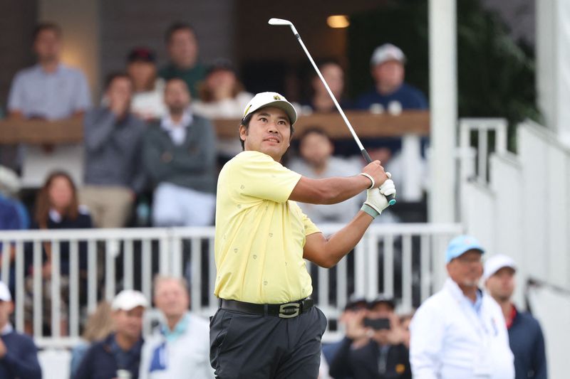 Sep 25, 2026; Medinah, Illinois, USA;  Hideki Matsuyama of the International Team reacts after teeing off on the 16th hole during the second round of the Presidents Cup.
