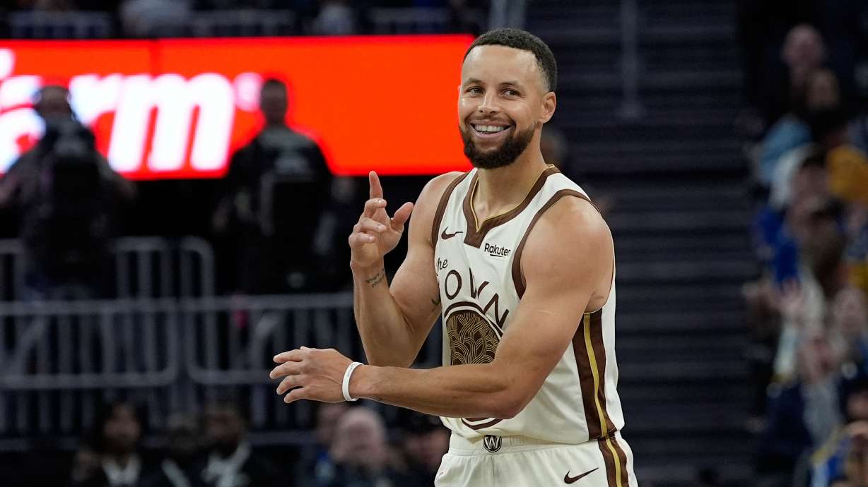 FILE - Golden State Warriors guard Stephen Curry reacts after making a 3-point basket during the second half of an NBA basketball game against the Sacramento Kings, Tuesday, April 7, 2026, in San Francisco.