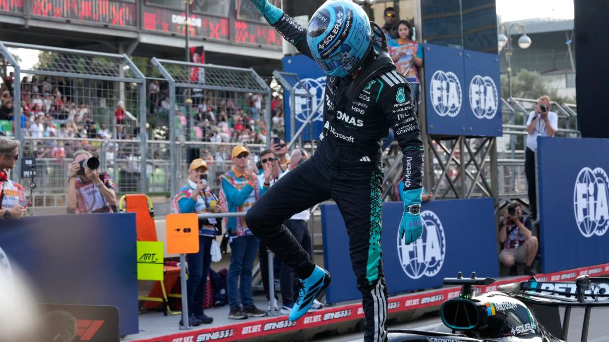 Mercedes driver George Russell of Britain celebrates after he clocked the fastest time during the qualifying session for the Azerbaijan F1 Grand Prix, in Baku, Azerbaijan, Friday, Sept. 25, 2026.