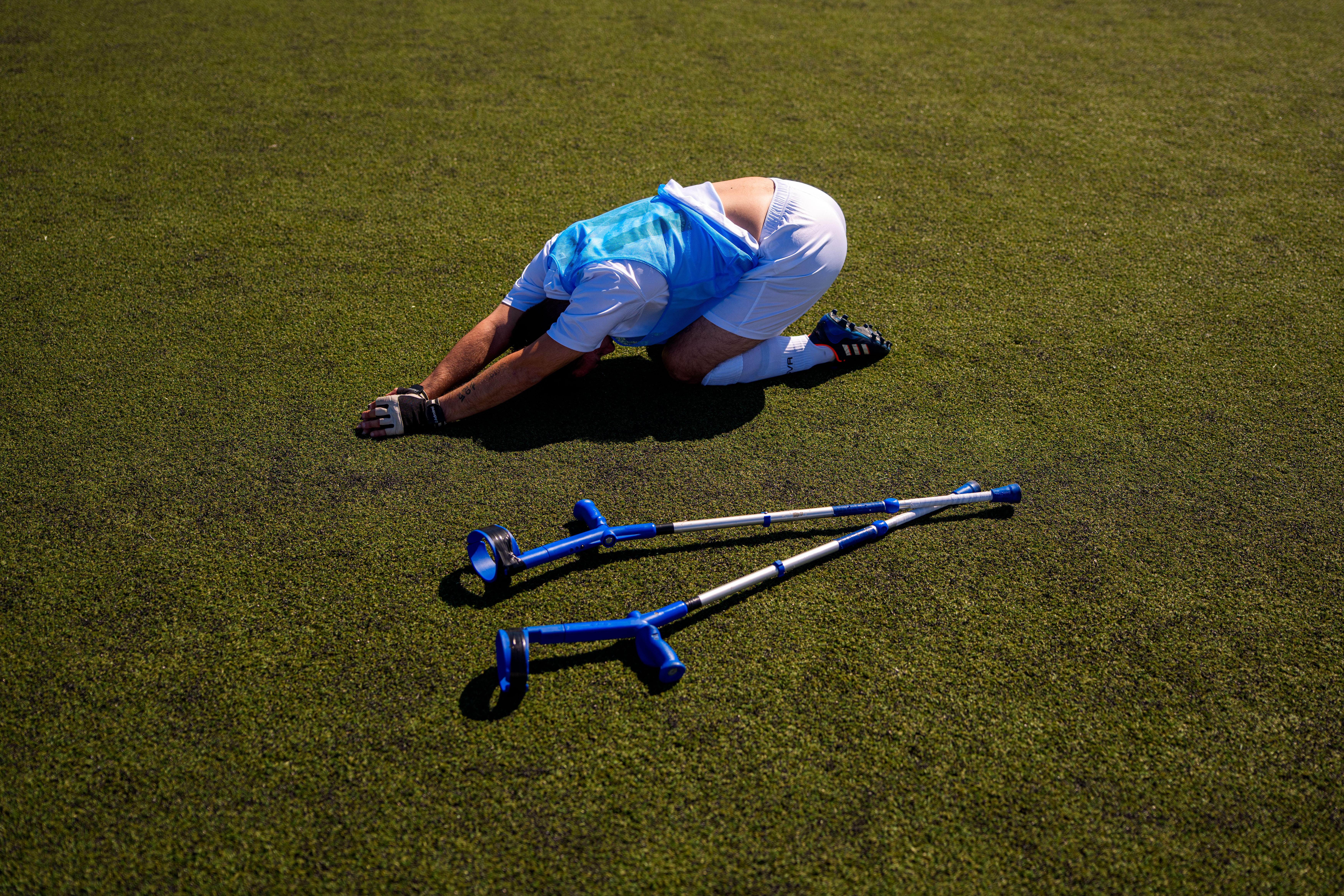 Panathinaikos' Vasileios Gogolos stretches during an amputee soccer match between Maccabi Haifa and Panathinaikos in the inaugural EAFF Conference League in Bucharest, Romania, Thursday, Sept. 24, 2026. 