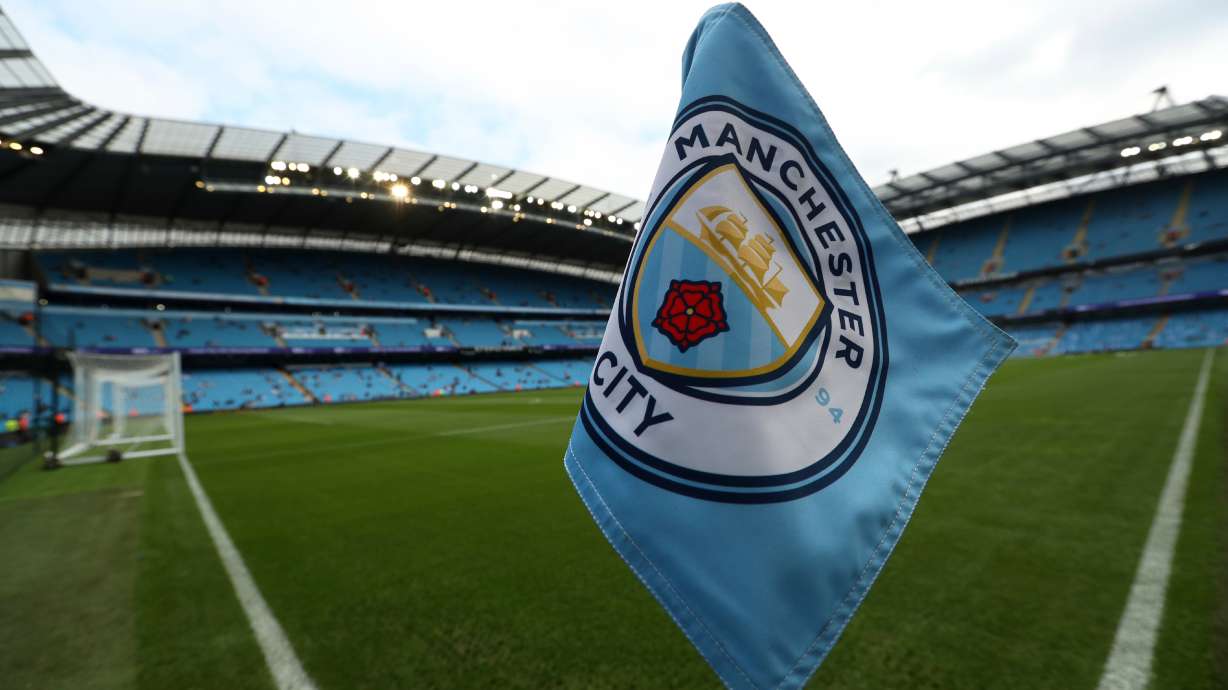 FILE - The club logo decorates a corner flag before the English Premier League soccer match between Manchester City and Newcastle United at the Etihad Stadium in Manchester, England, Saturday, Sept. 1, 2018.