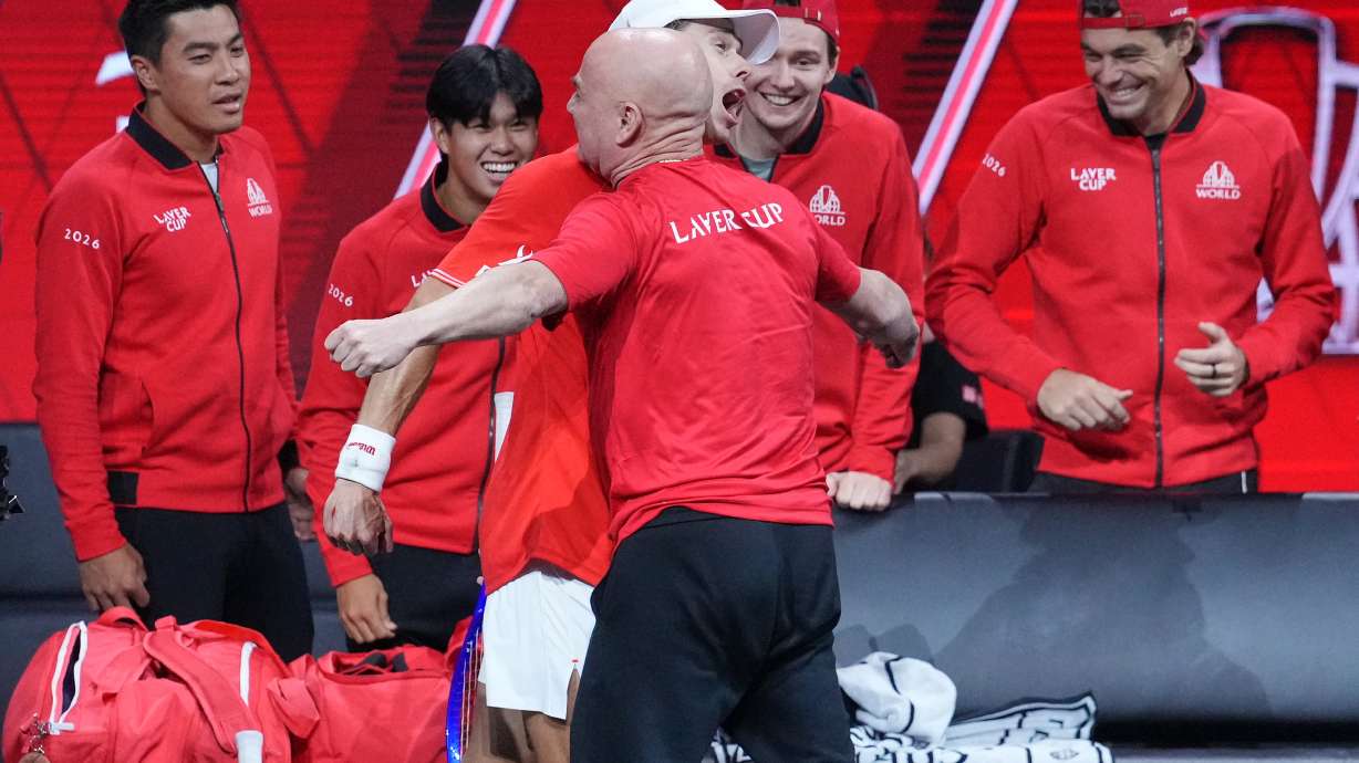 Team World's Alex De Minaur celebrates with Team World captain Andre Agassi after beating Team Europe's Alexander Zverev in a Laver Cup tennis tournament match in London, Saturday, Sept. 26, 2026.