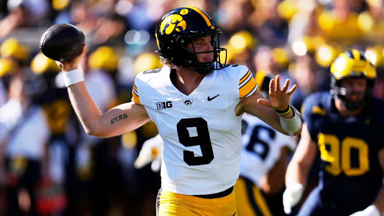 Iowa quarterback Hank Brown (9) throws against Michigan during the first half of an NCAA college football game in Ann Arbor, Mich., Saturday, Sept. 26, 2026.