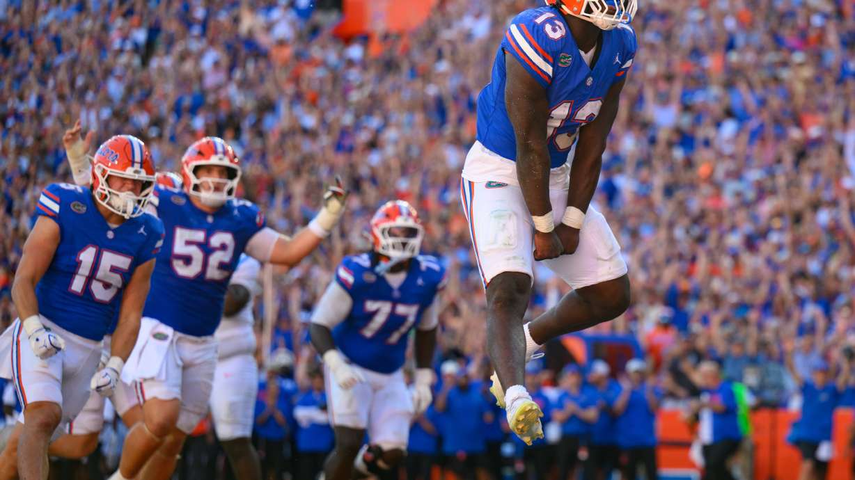 Florida running back Jadan Baugh (13) jumps in celebration after rushing for a touchdown during the first half of an NCAA college football game against Mississippi, Saturday, Sept. 26, 2026, in Gainesville, Fla.