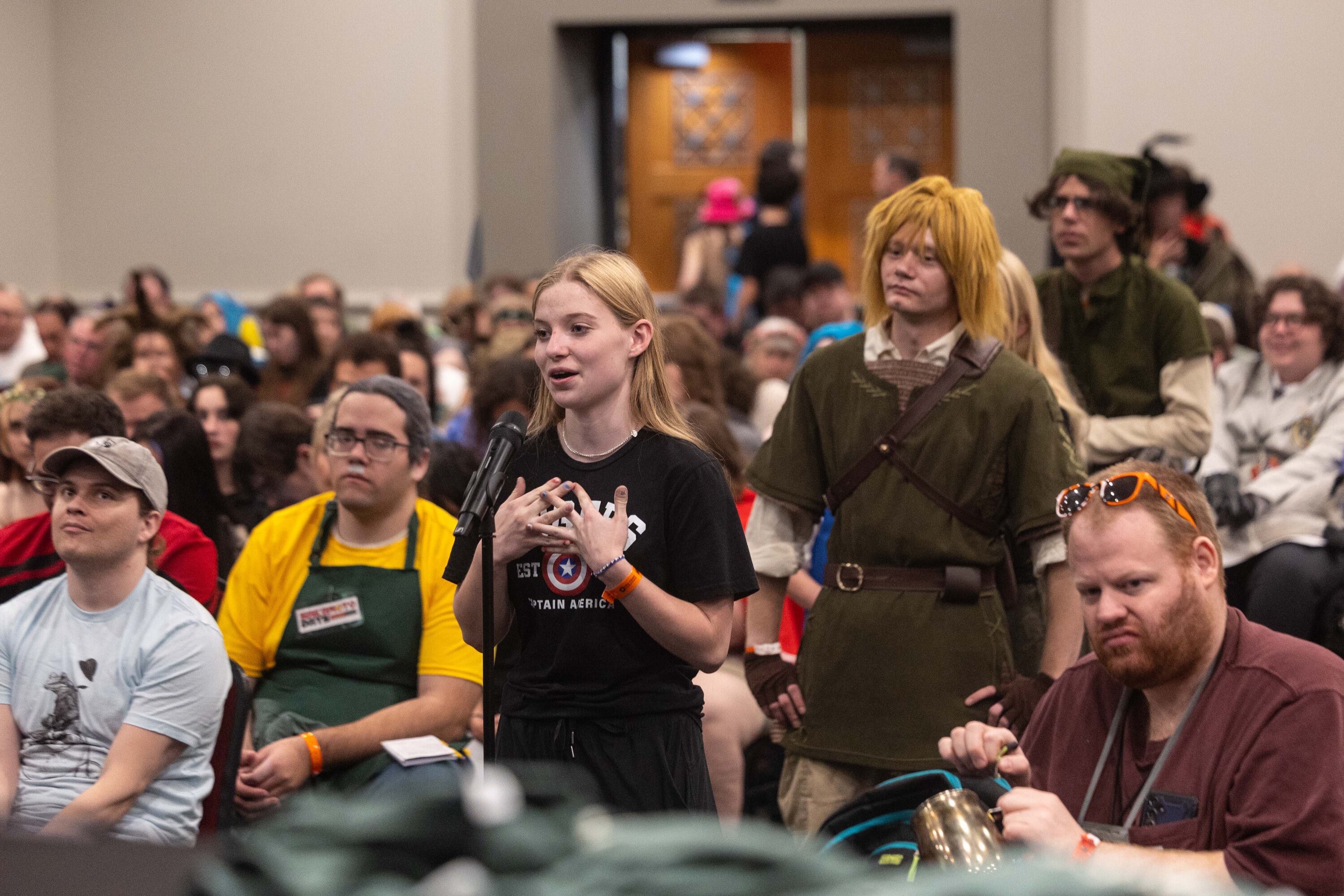 Josephine Ainge, a fan of the "Fablehaven" series, asks a question to Brandon Mull during the FanX Salt Lake Comic Convention on Saturday. Mull expressed cautious optimism as the movie takes shape.