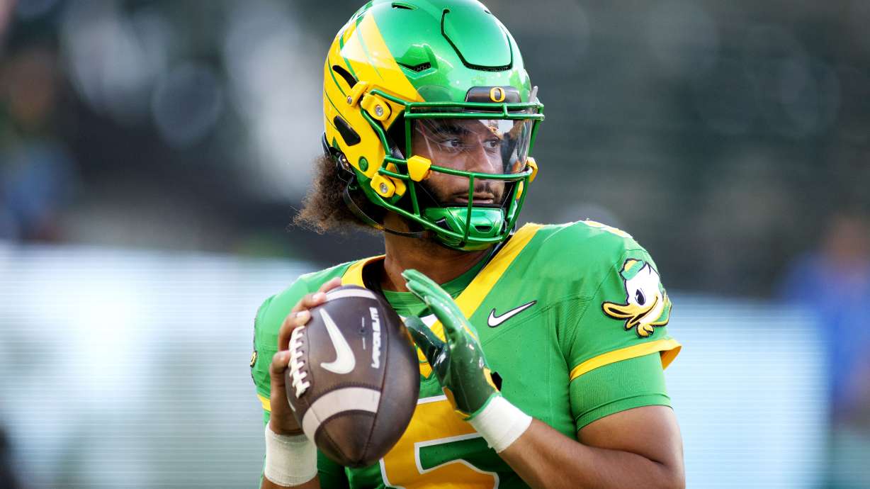 Oregon quarterback Dante Moore warms up before an NCAA college football game against Portland State, Friday, Sept. 18, 2026, in Eugene, Ore.