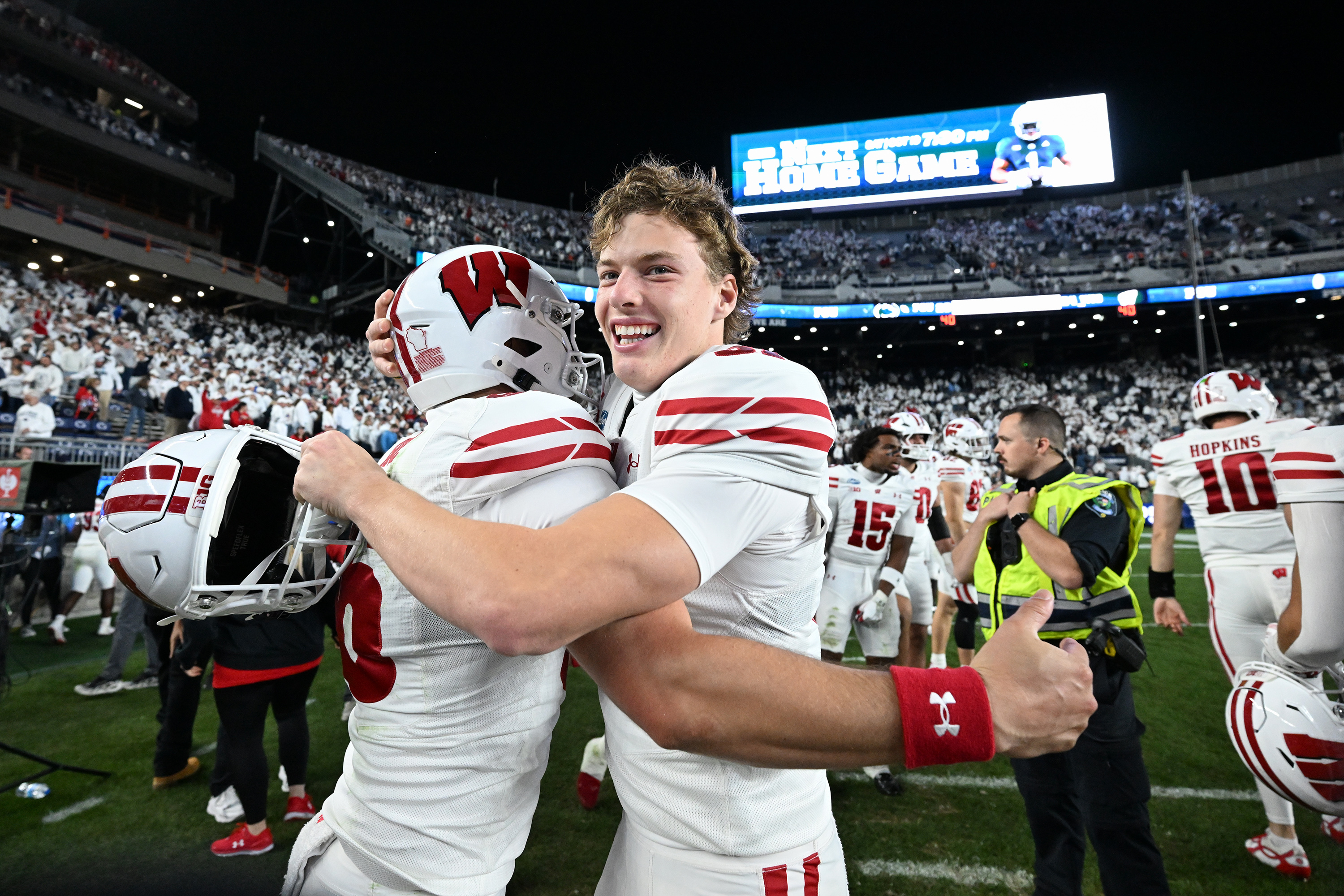 Wisconsin's Sean West, right, celebrates with James Roe, left, after their team defeated Penn State in an NCAA college football game, Saturday, Sept. 26, 2026, in State College, Pa. 