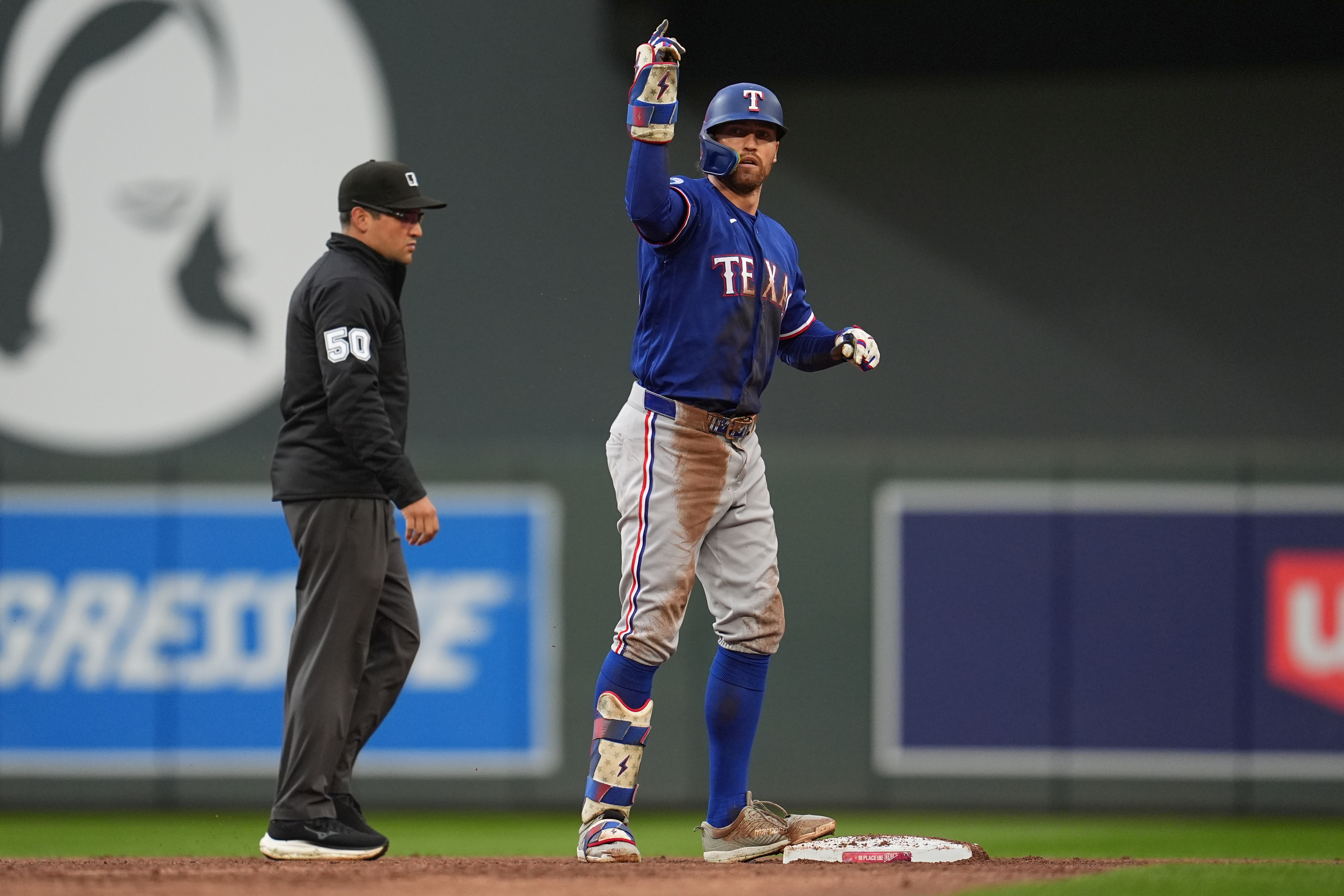 Texas Rangers' Brandon Nimmo celebrates after hitting an RBI-double during the second inning of a baseball game against the Minnesota Twins Saturday, Sept. 26, 2026, in Minneapolis. 