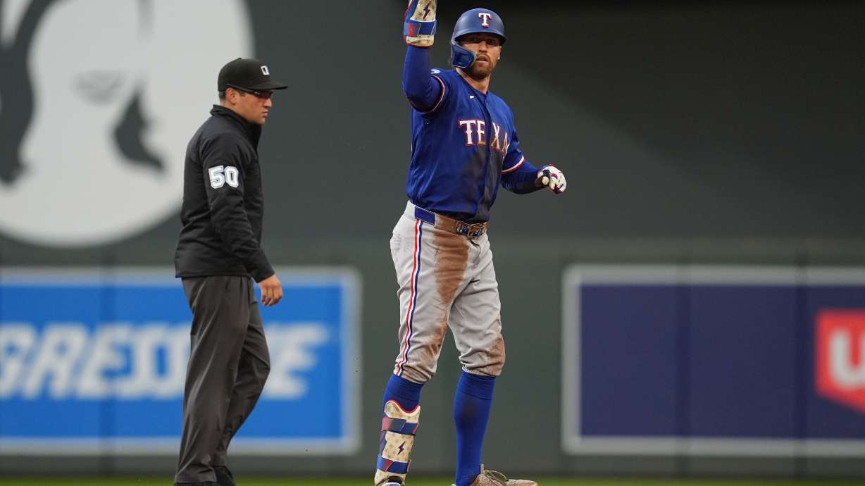 Texas Rangers' Brandon Nimmo celebrates after hitting an RBI-double during the second inning of a baseball game against the Minnesota Twins Saturday, Sept. 26, 2026, in Minneapolis.