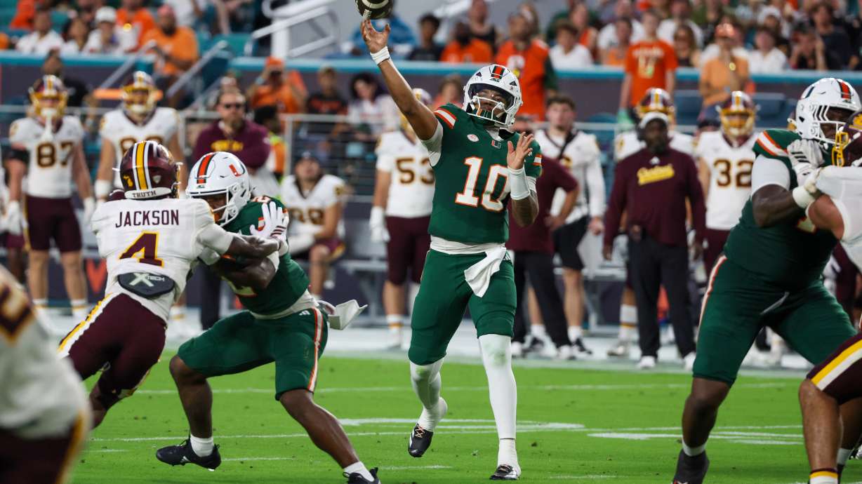 Miami quarterback Darian Mensah (10) throws a touchdown pass against Central Michigan during the first half of an NCAA college football game, Saturday, Sept. 26, 2026, in Miami Gardens, Fla.
