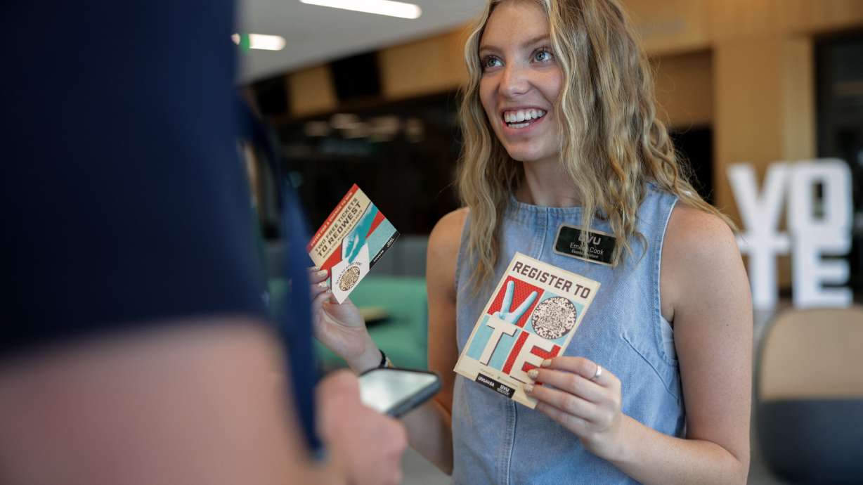 Utah Valley University senior Emilee Cook of the Herbert Institute for Public Policy talks to other students about voter registration as part of a statewide challenge sponsored by the lieutenant governor’s office, Wednesday in Orem.