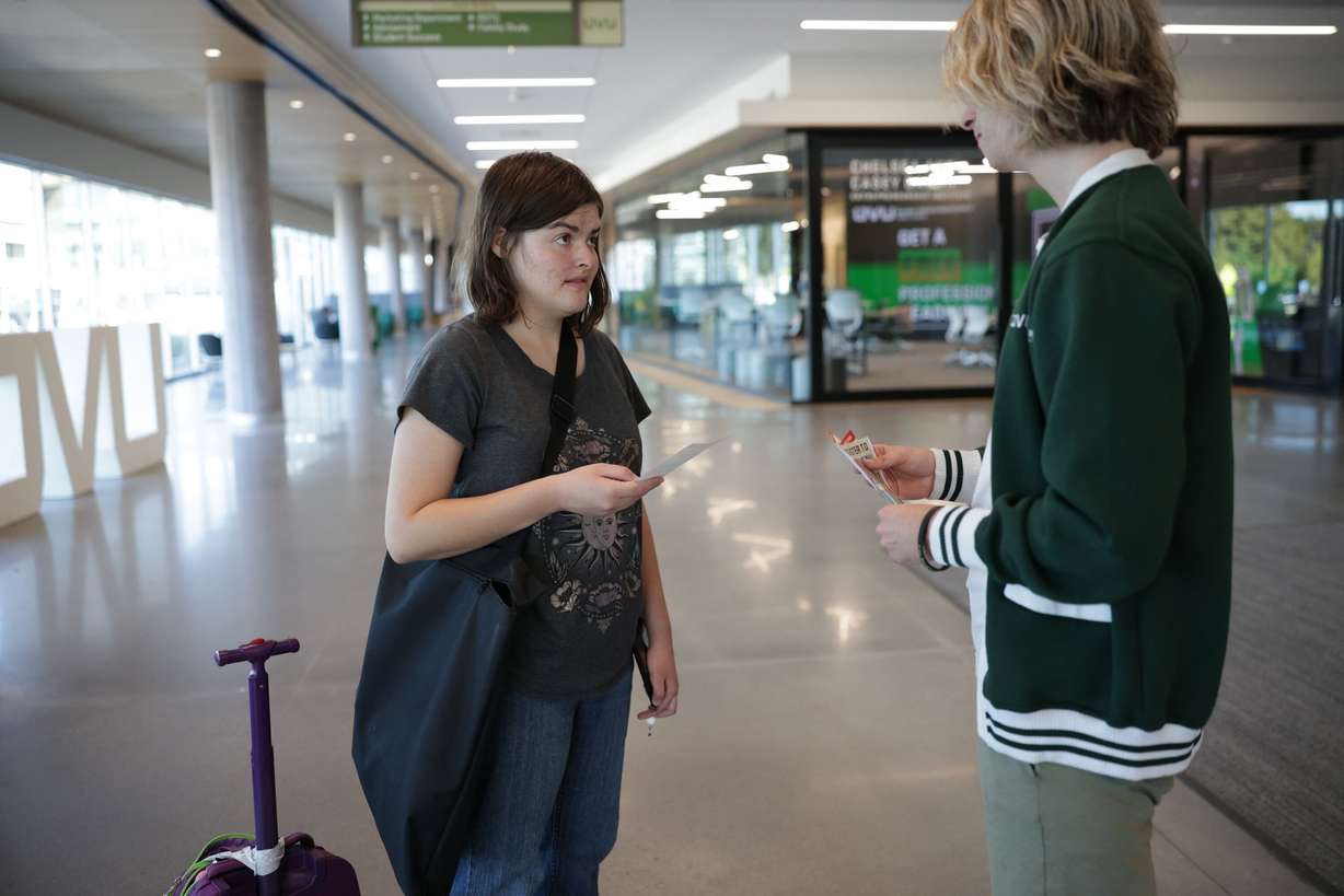 Utah Valley University freshman Sydney Newbry, left, talks to junior Reese Boardman of the Herbert Institute for Public Policy about voter registration as part of a statewide challenge sponsored by the lieutenant governor’s office, Wednesday, in Orem.