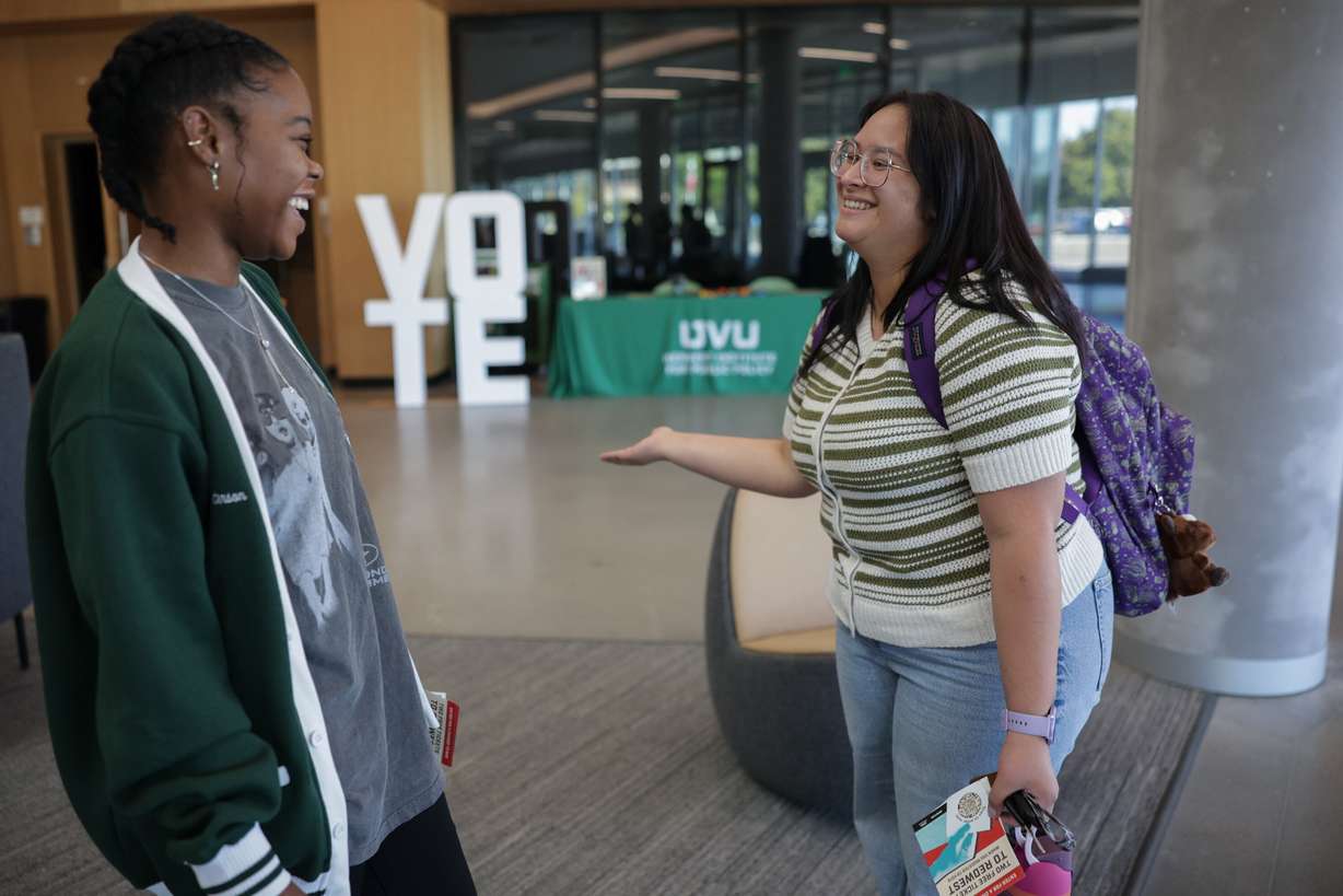 Utah Valley University junior Brooke Peterson of the Herbert Institute for Public Policy, left, talks to junior Meg Pfister about voter registration as part of a statewide challenge sponsored by the lieutenant governor’s office, Wednesday, in Orem.