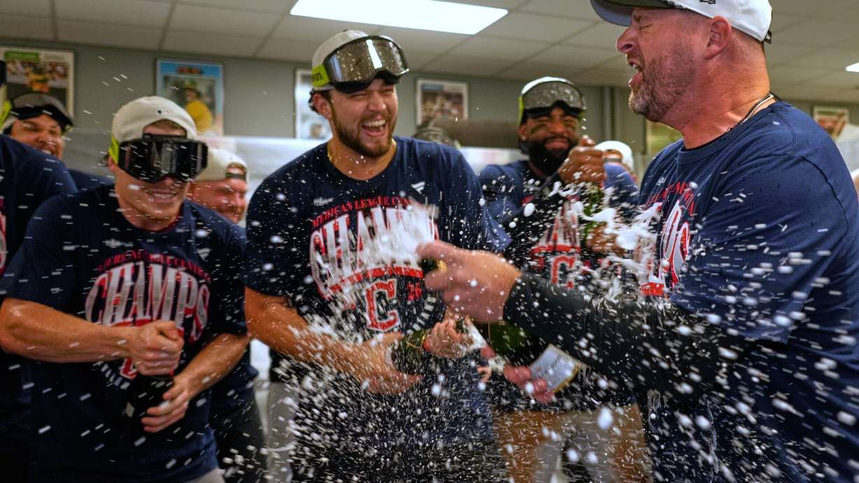 Cleveland Guardians players celebrate with manager Stephen Vogt, rigtht, after clinching the American League Central division title by defeating the Kansas City Royals in a baseball game Saturday, Sept. 26, 2026, in Kansas City, Mo.