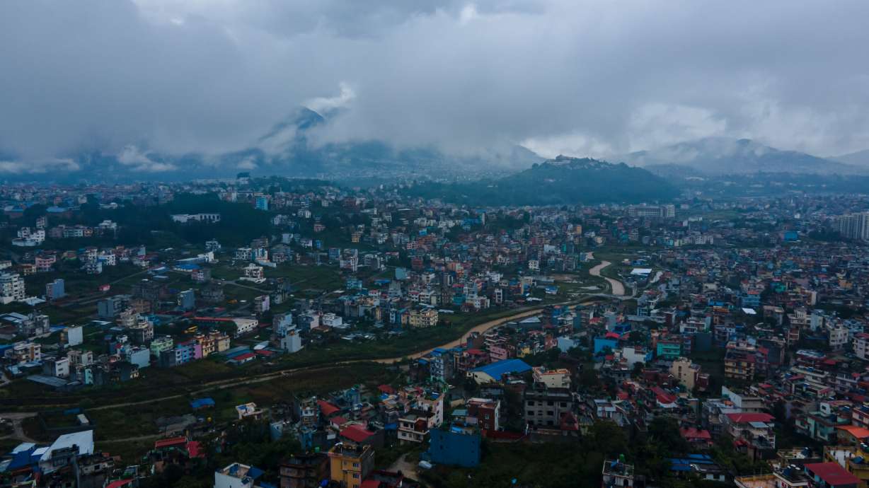 An aerial view of the cityscape under rainy skies in Lalitpur, Nepal, on September 27, 2026. Rainfall disrupts daily activities as a deep depression over the Bay of Bengal influences weather conditions in the region.