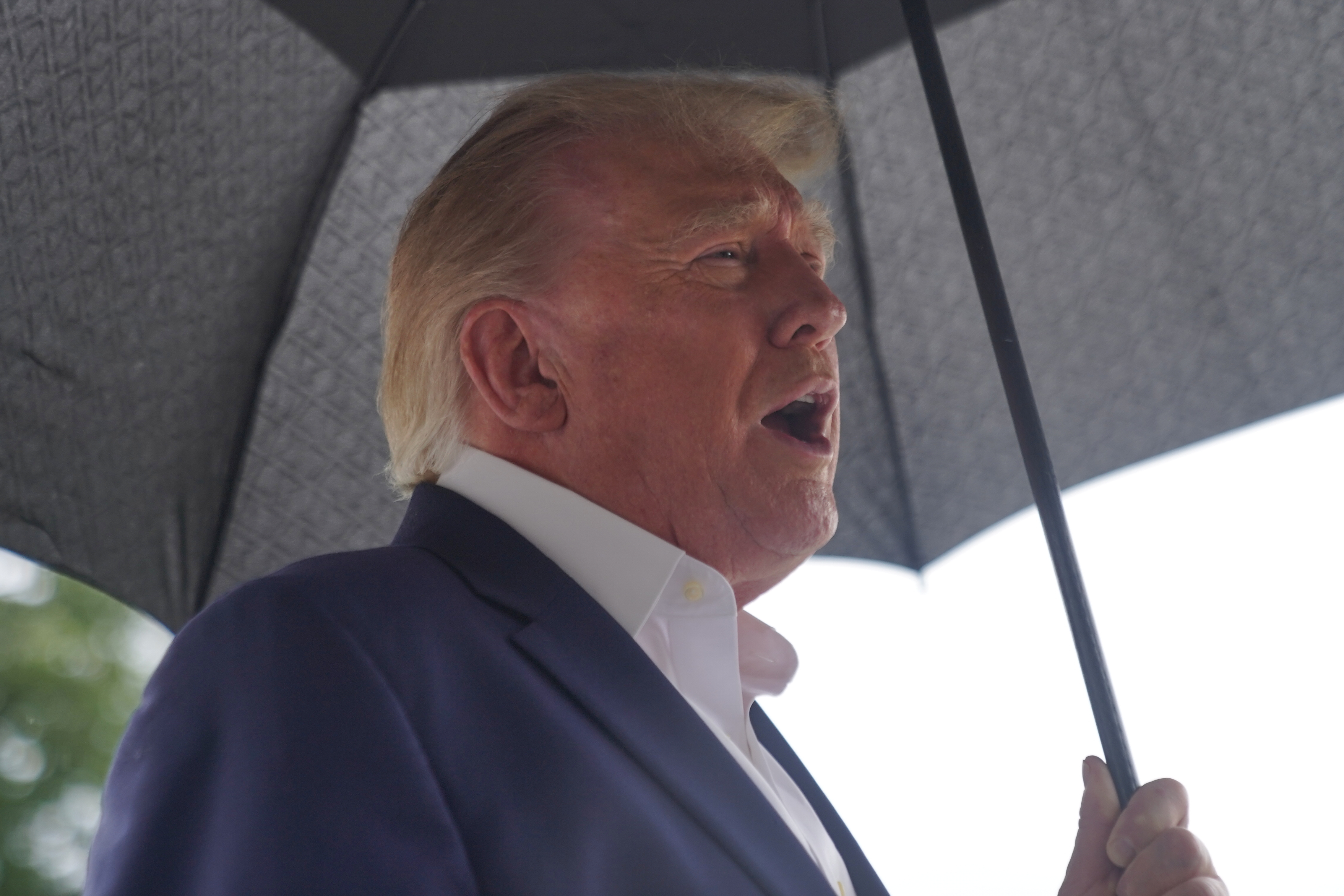 President Donald Trump talks to reporters on the South Lawn of the White House before boarding Marine One, Sunday, Sept. 27, 2026, in Washington. 