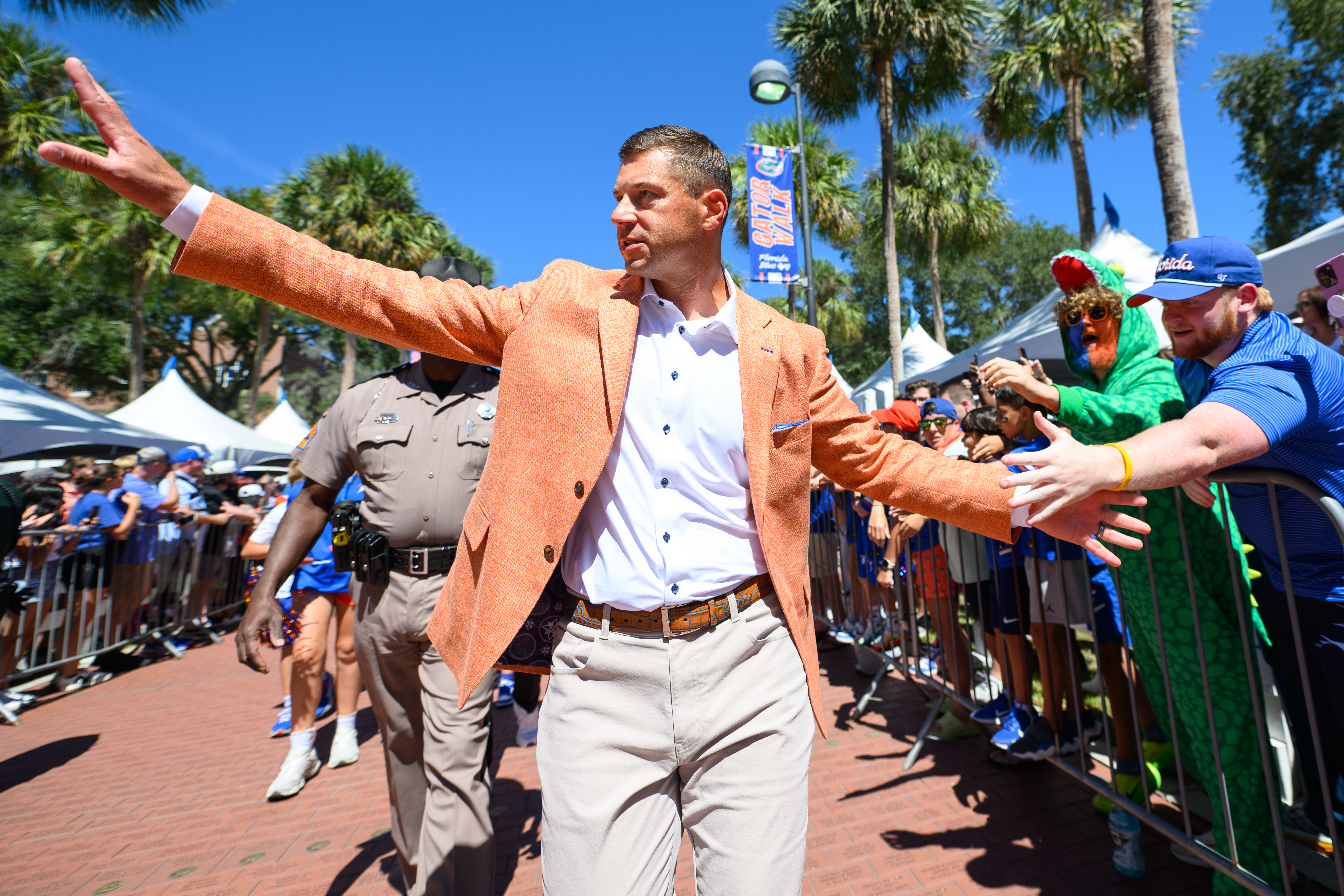Florida head coach Jon Sumrall greets fans along Gator Walk before an NCAA college football game against Mississippi, Saturday, Sept. 26, 2026, in Gainesville, Fla. 