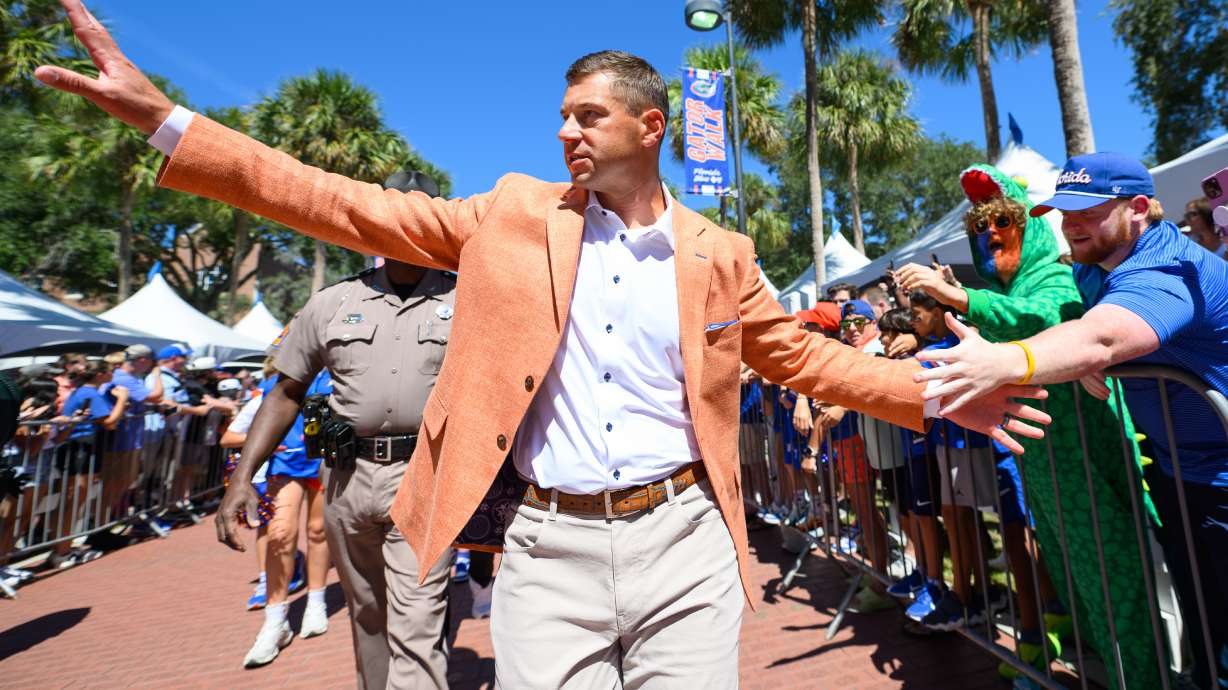 Florida head coach Jon Sumrall greets fans along Gator Walk before an NCAA college football game against Mississippi, Saturday, Sept. 26, 2026, in Gainesville, Fla.