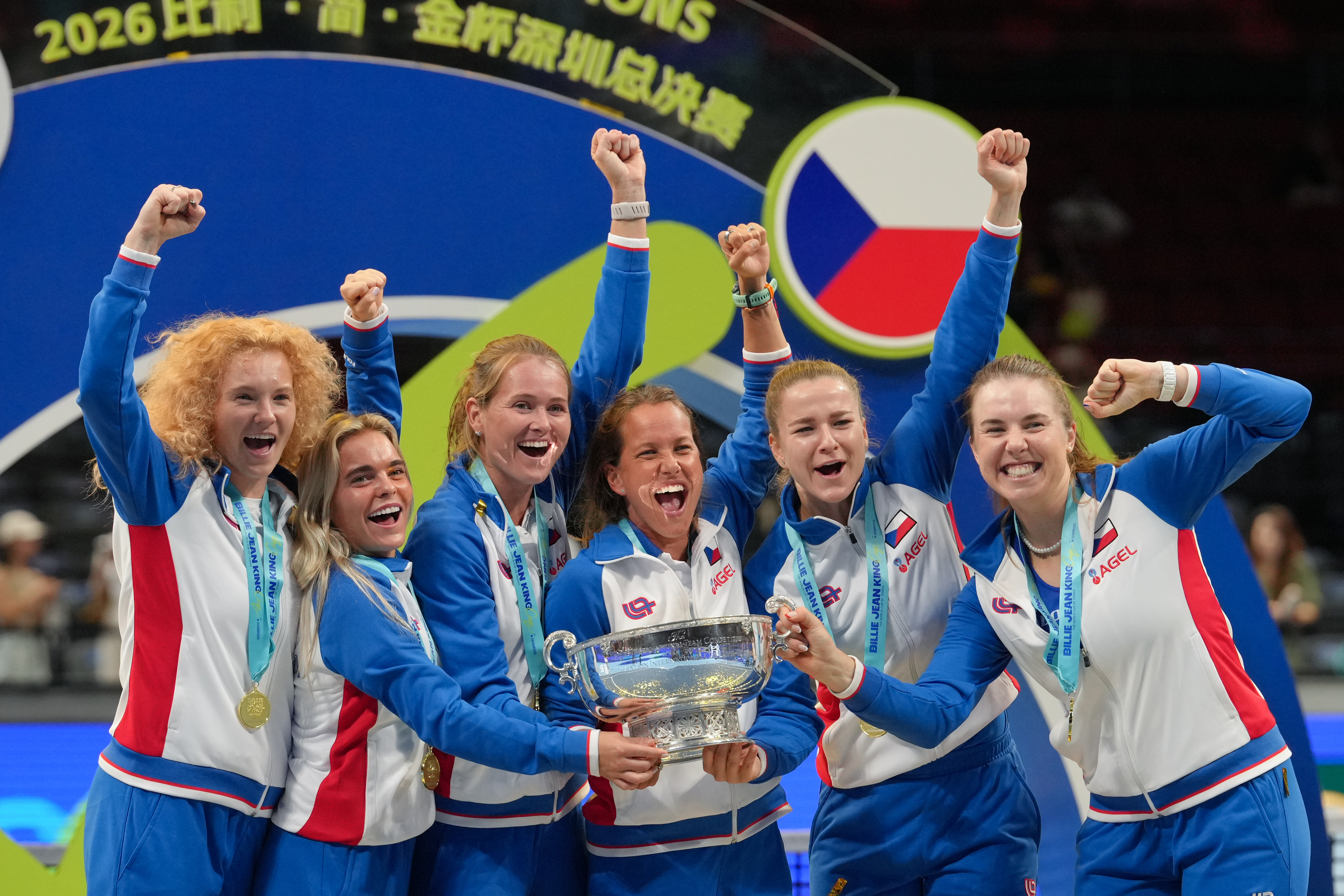Czech Republic team members celebrate after receiving the trophy following their victory over Ukraine in the Billie Jean King Cup final in Shenzhen, China, Sunday, Sept. 27, 2026. 