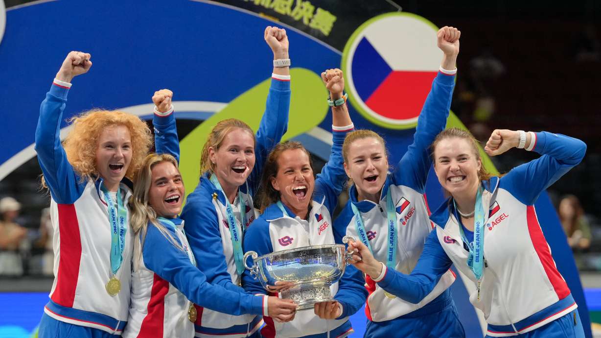 Czech Republic team members celebrate after receiving the trophy following their victory over Ukraine in the Billie Jean King Cup final in Shenzhen, China, Sunday, Sept. 27, 2026.