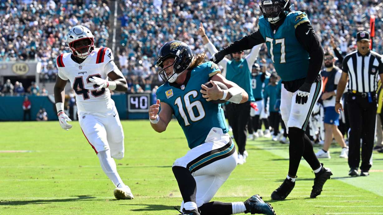 Jacksonville Jaguars quarterback Trevor Lawrence (16) kneels against the New England Patriots in the second half during an NFL football game in Jacksonville, Fla., Sunday, Sept. 27, 2026.