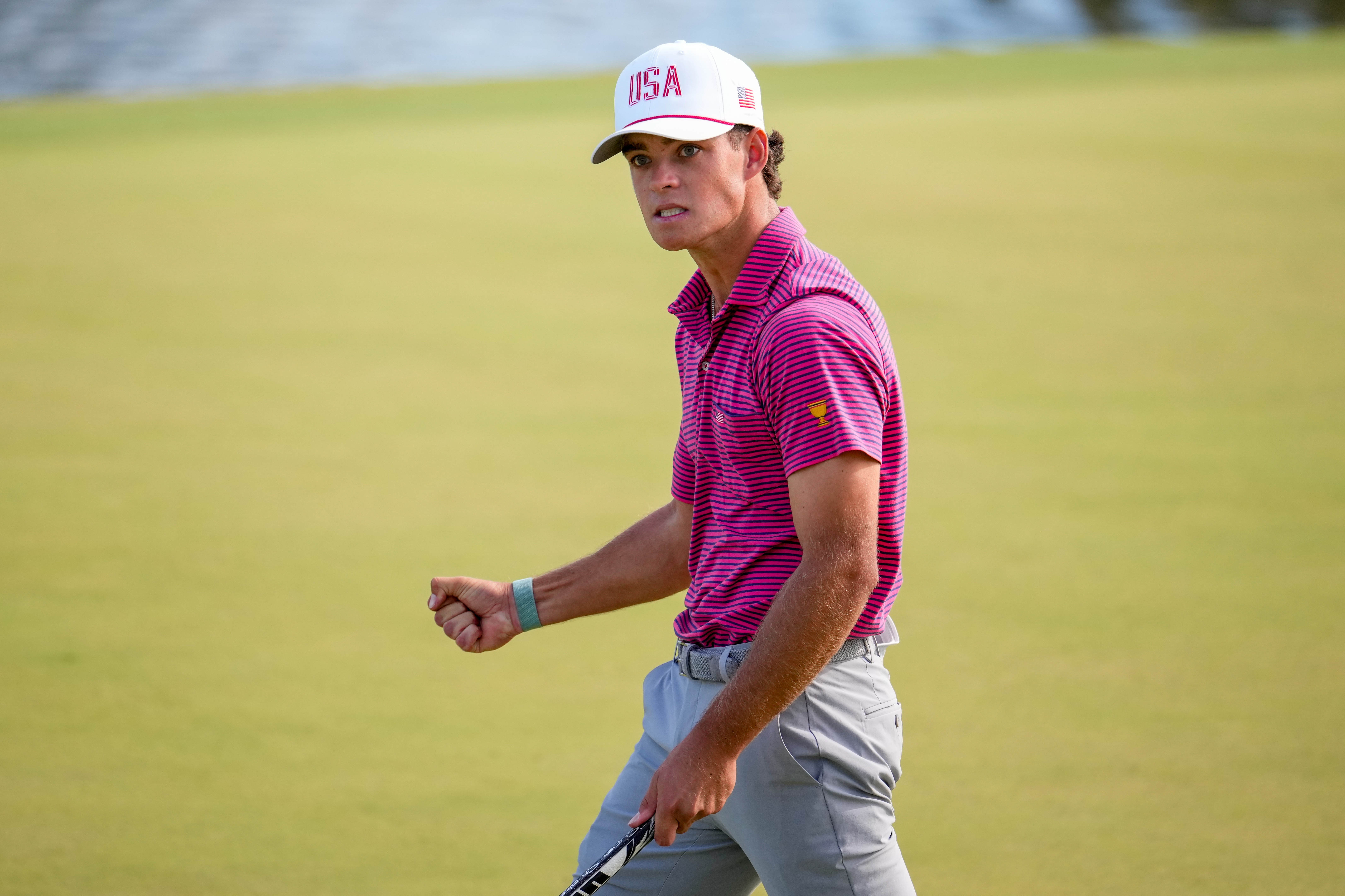 USA teams' Jackson Koivun reacts to his birdie putt on the 12th hole against the International team during a Presidents Cup golf tournament final round singles match at Medinah Country Club, Sunday, Sept. 27, 2026, in Medinah, Ill. 