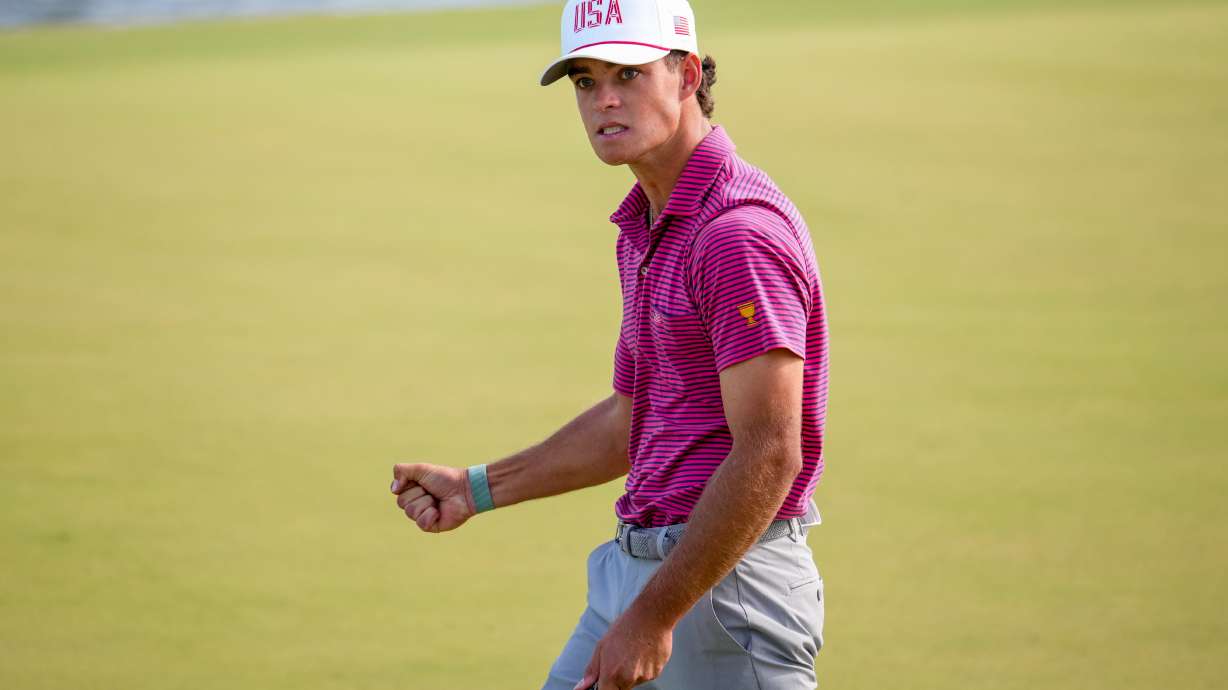 USA teams' Jackson Koivun reacts to his birdie putt on the 12th hole against the International team during a Presidents Cup golf tournament final round singles match at Medinah Country Club, Sunday, Sept. 27, 2026, in Medinah, Ill.