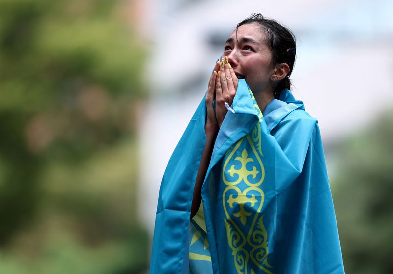 Asian Games - Aichi-Nagoya 2026 - Race Walk - Aichi Prefectural Government Office and Nagoya City Hall Loop Course, Nagoya, Japan - September 27, 2026 Kazakhstan's Yasmina Toxanbayeva celebrates finishing in first place to win the gold in the Women's Marathon Race Walk