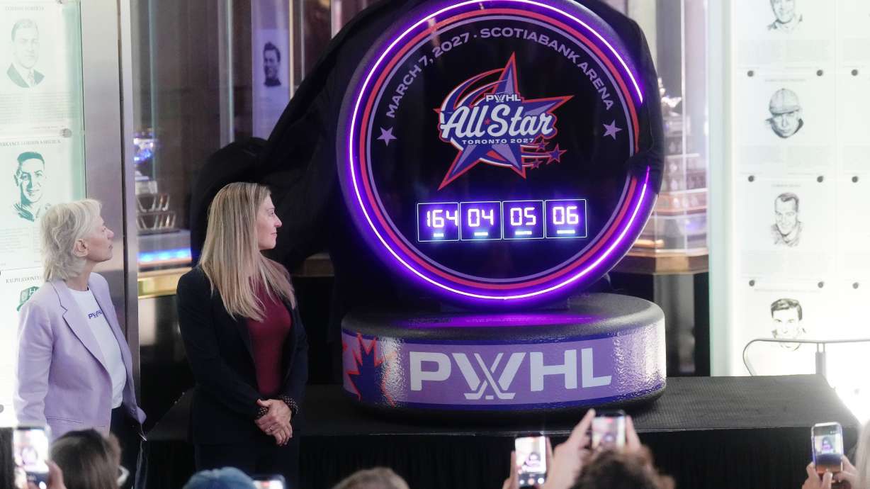 Jayna Hefford, second from left, Executive Vice President of Hockey Operations for the PWHL, and Amy Scheer, left, PWHL Executive Vice President of Business Operations, unveils the logo for the first ever PWHL All-Star-Game which will take place in Toronto next year during a press conference in Toronto, Thursday, Sept. 24, 2026.