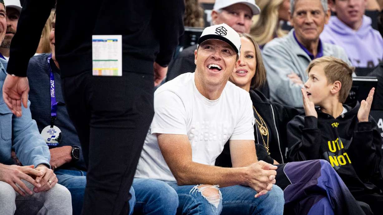 Utah Jazz owner Ryan Smith smiles as he watches a Jazz game at the Delta Center in Salt Lake City on Jan. 30. Smith launched a survey on Wednesday seeking local brand suggestions within a planned district east of the arena.