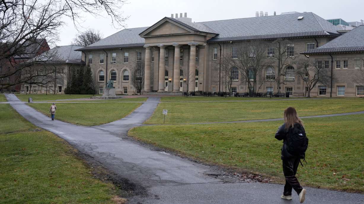 People walk on the campus of Cornell University in Ithaca, N.Y., Feb. 2, 2024.