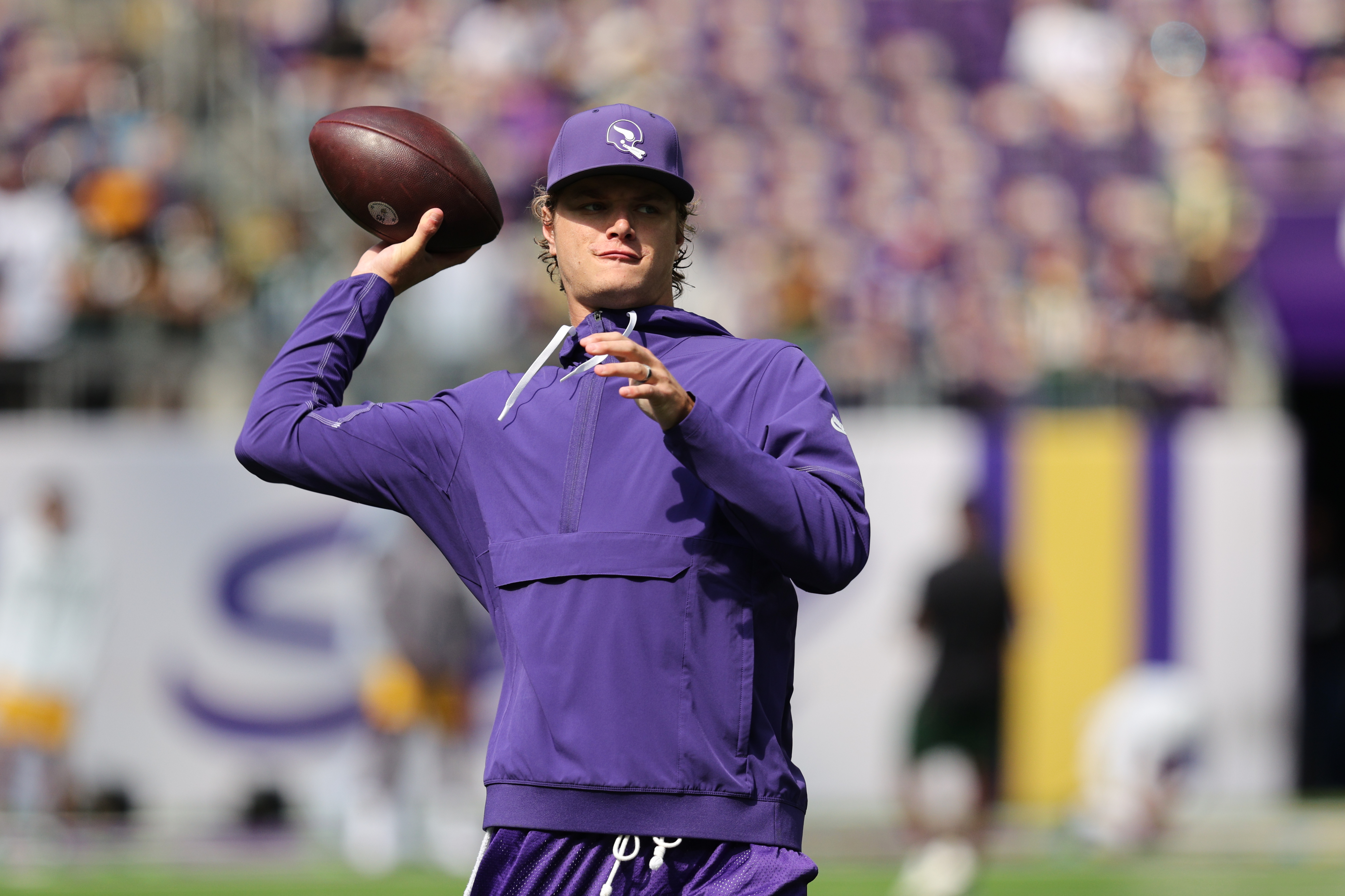 Minnesota Vikings quarterback J.J. McCarthy warms up before an NFL football game against the Green Bay Packers, Sunday, Sept. 13, 2026, in Minneapolis, Minn. 