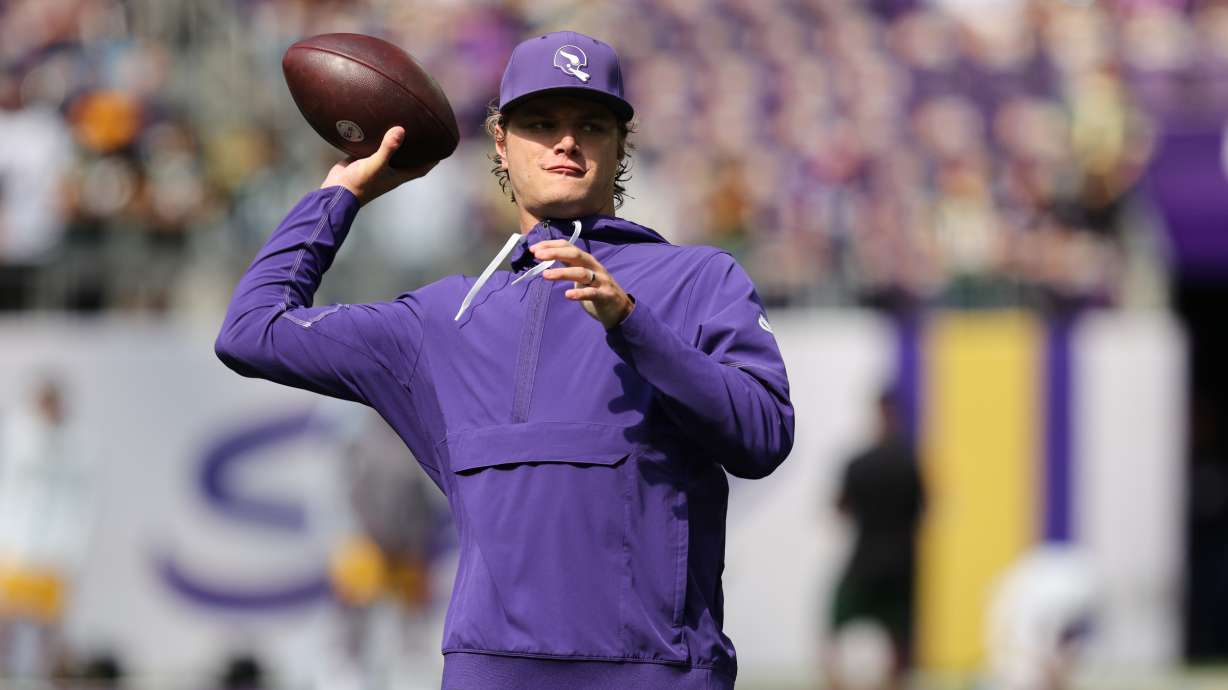 Minnesota Vikings quarterback J.J. McCarthy warms up before an NFL football game against the Green Bay Packers, Sunday, Sept. 13, 2026, in Minneapolis, Minn.