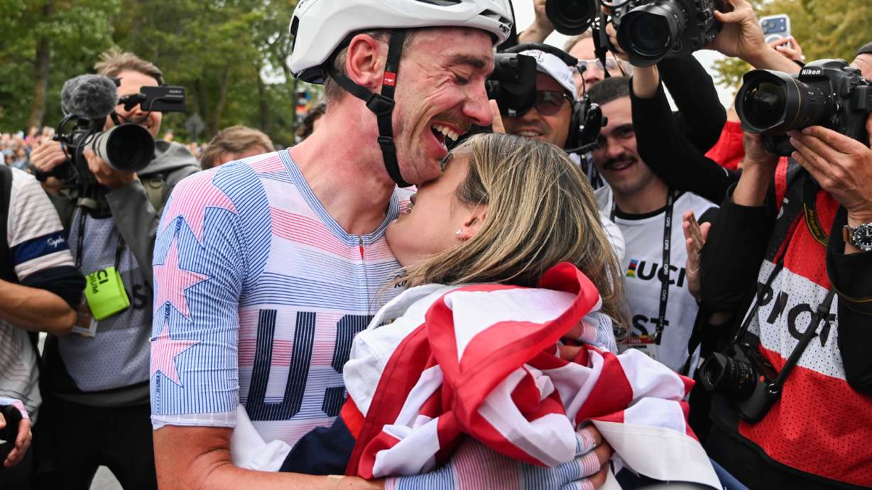 Brandon McNulty, of the United States, is hugged by his wife Summer after winning the men's elite road race at the UCI Road World Championships cycling event in Montreal on Sunday, Sept. 27, 2026.