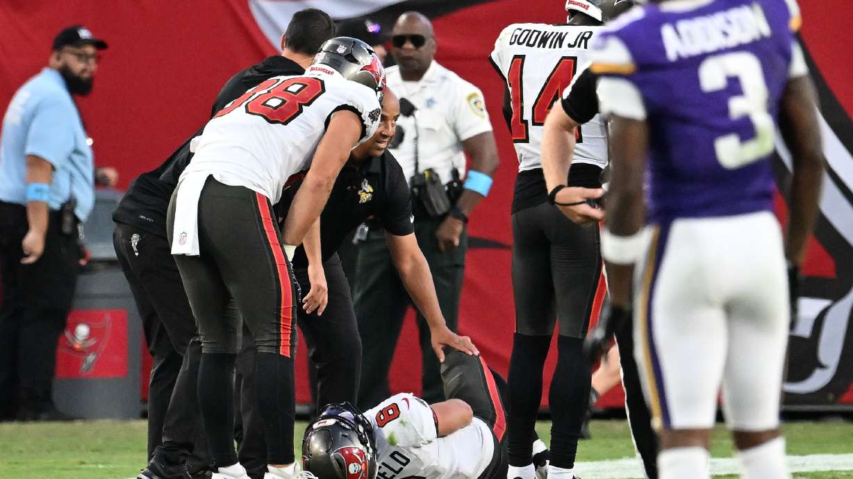 Tampa Bay Buccaneers quarterback Baker Mayfield (6) lays on the ground after sustaining an injury during the second half of an NFL football game against the Minnesota Vikings in Tampa, Fla., Sunday, Sept. 27, 2026.