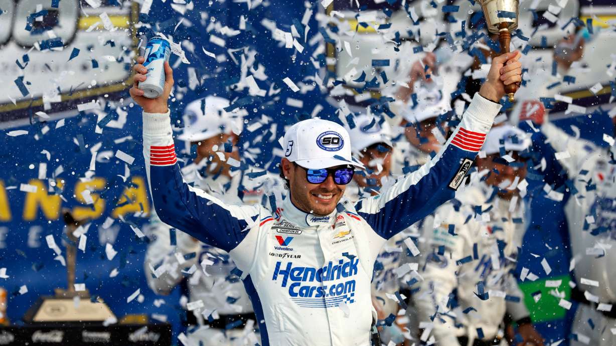 Kyle Larson celebrates in Victory Lane after winning a NASCAR Cup Series auto race in Kansas City, Kan., Sunday, Sept. 27, 2026.