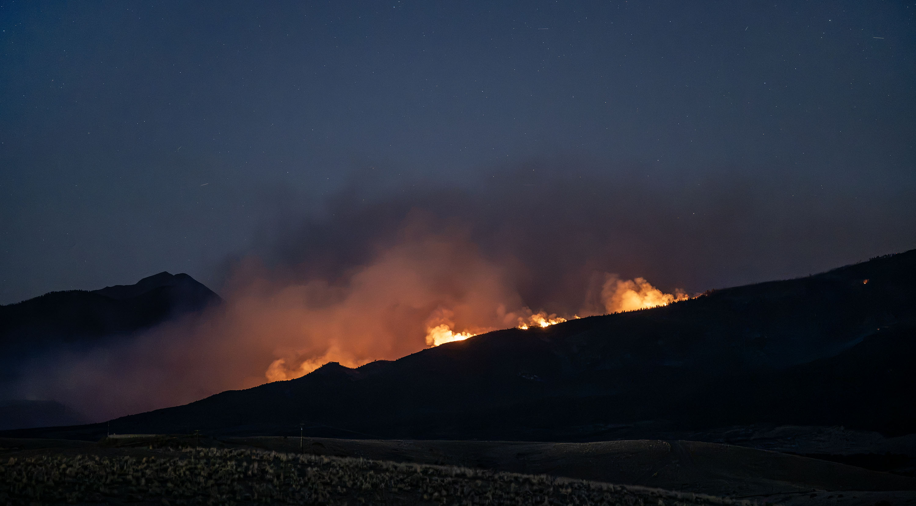 The Cottonwood Fire burning in the mountains east of Beaver on June 30, 2026.