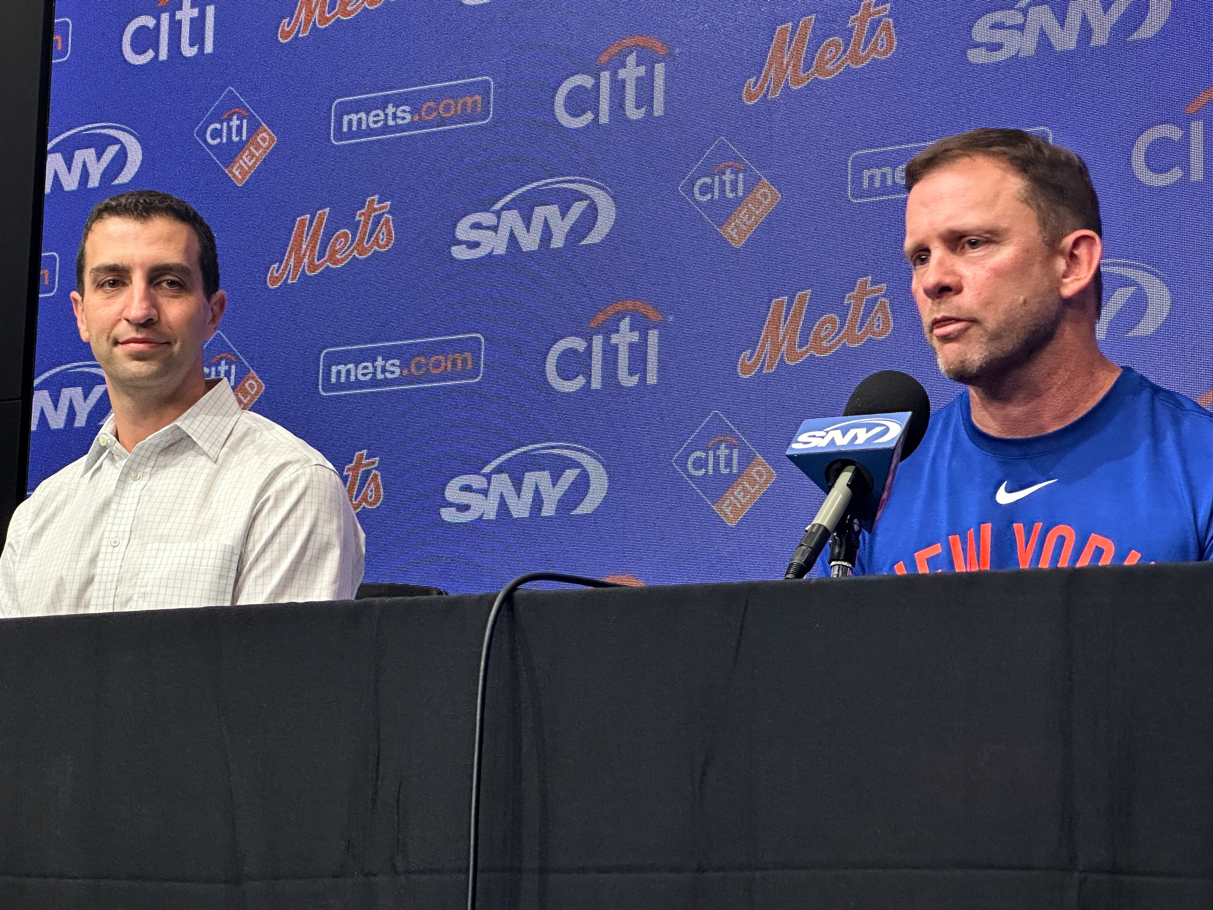 Andy Green, right, responds to question during a news conference where he was introduced as the New York Mets new manager as President of Baseball Operations David Stearns, left, looks on before a baseball game against the Texas Rangers Tuesday, Sept. 22, 2026, in Arlington, Texas. 