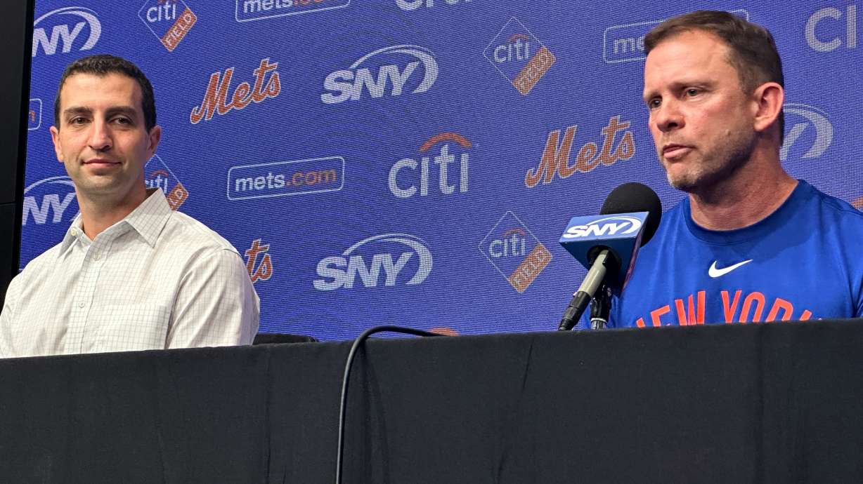 Andy Green, right, responds to question during a news conference where he was introduced as the New York Mets new manager as President of Baseball Operations David Stearns, left, looks on before a baseball game against the Texas Rangers Tuesday, Sept. 22, 2026, in Arlington, Texas.