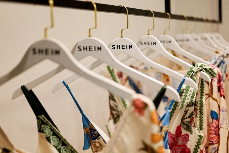 FILE PHOTO: Clothes from fast-fashion brand Shein hang at their office in Sao Paulo, Brazil, December 15, 2025.