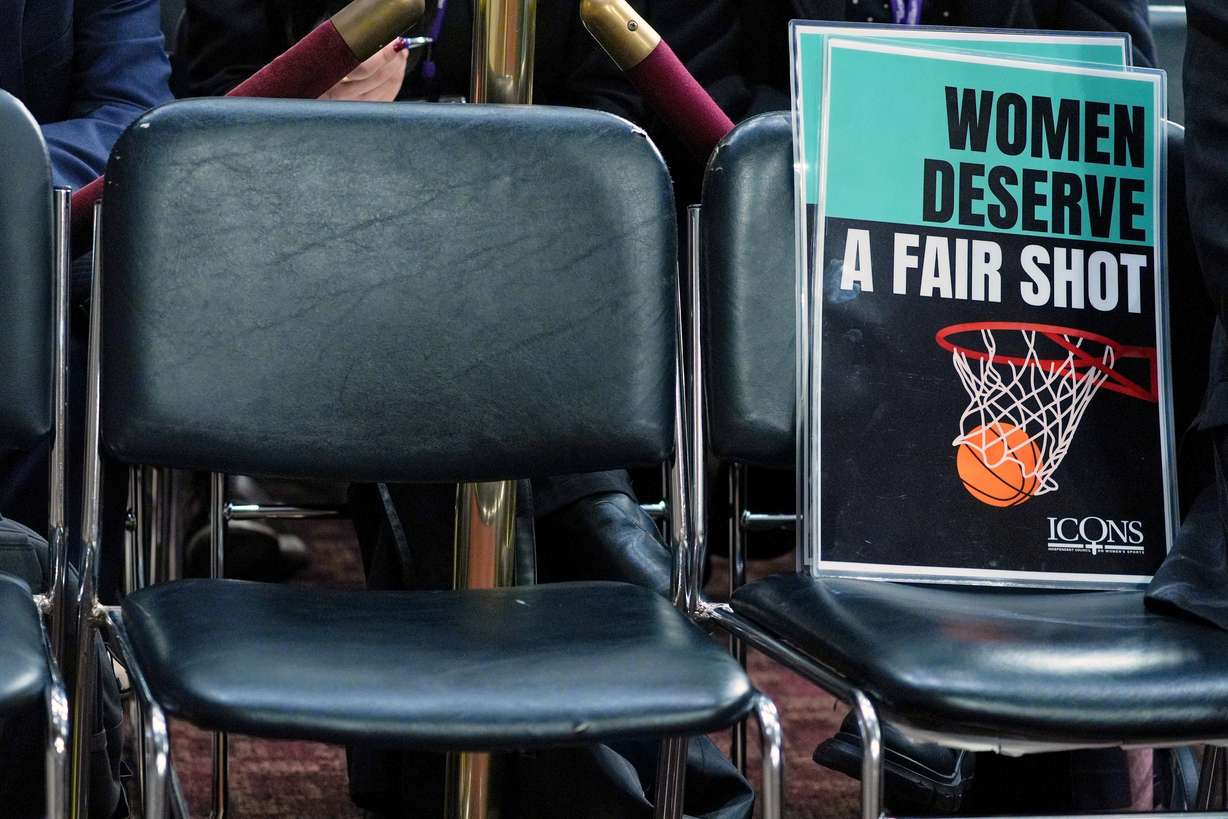 A sign is seen during a Senate hearing on Capitol Hill, Wednesday, in Washington. The Protect College Sports Act passed the Senate by a 77-22 vote late Monday.