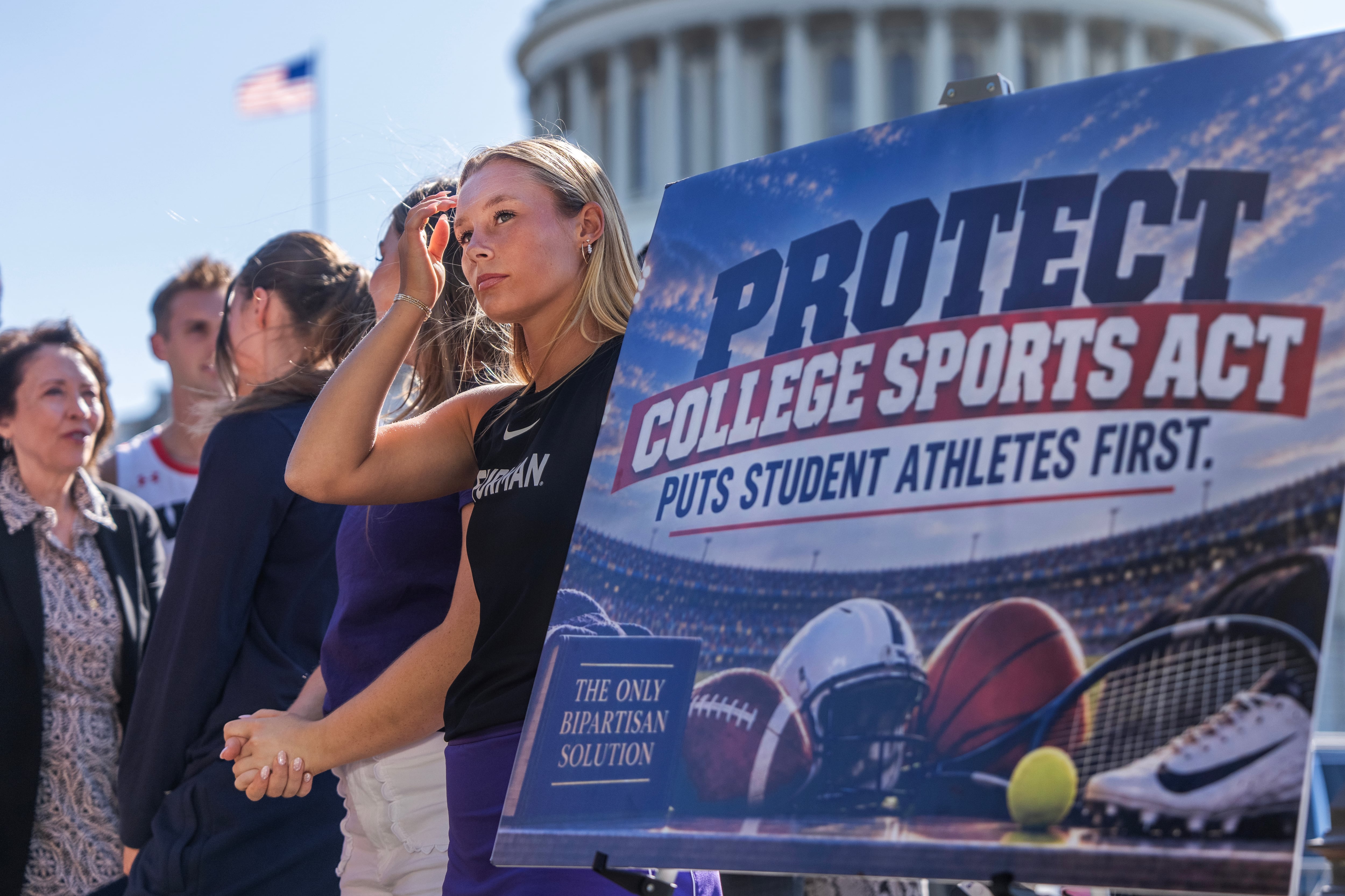 Macy Hitchcock, a Furman University tennis player, attends a news conference with student athletes and coaches outside the U.S. Capitol on the "Protect College Sports Act," on Sept. 14. The act passed the Senate by a 77-22 vote late Monday.