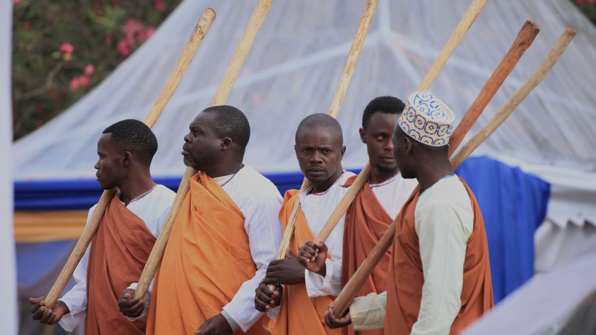 Mourners gather for the funeral of Tooro's King Oyo Nyimba in the remote city of Fort Portal, near the Congo border in Uganda, Sept. 12. A TV journalist was crowned Oyo's successor.