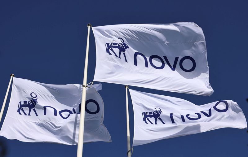 Flags with the logo of pharmaceutical company Novo flutter in front of its offices in Bagsvaerd, Copenhagen, Denmark, September 21, 2026.