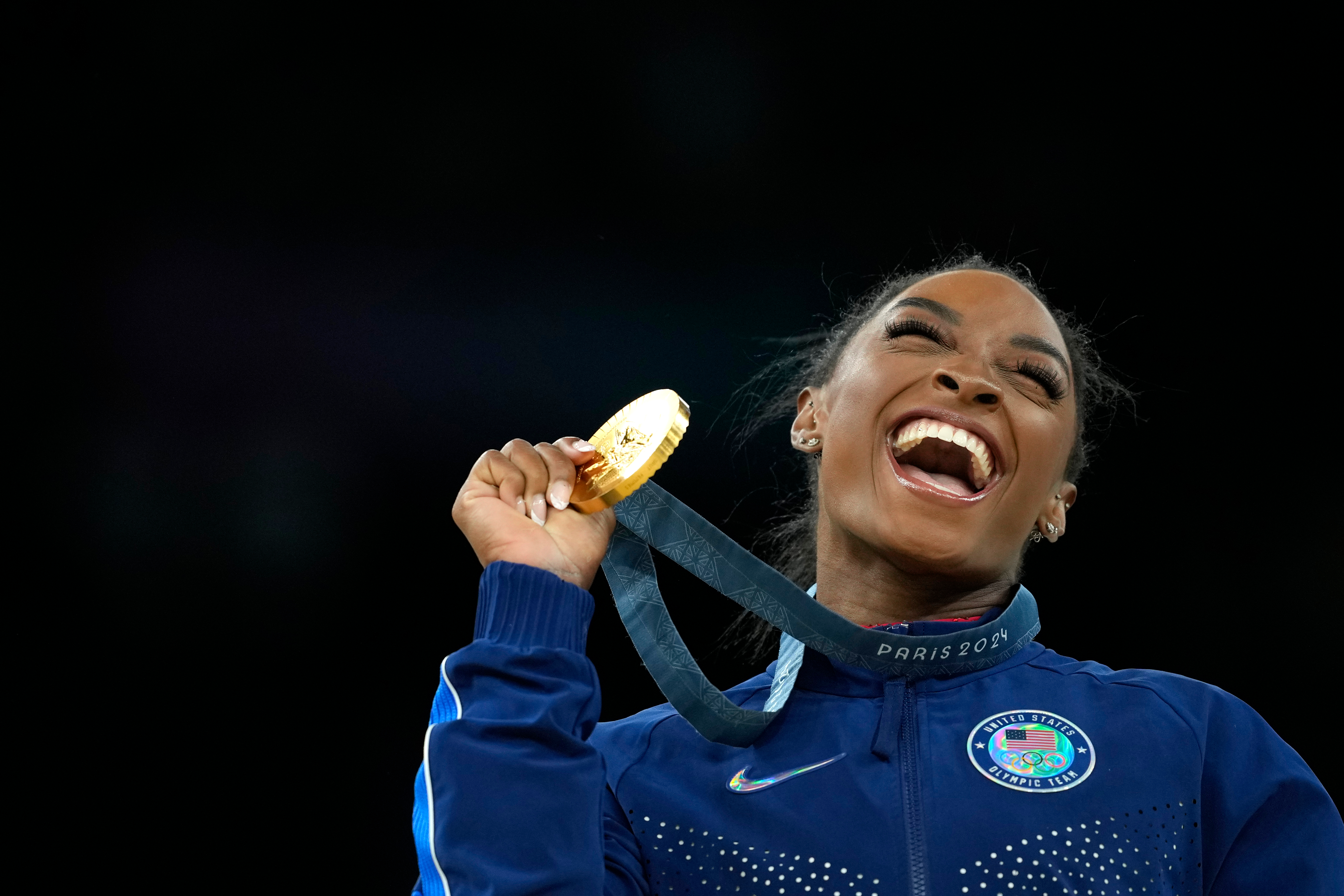 FILE - Simone Biles, of the United States, celebrates after winning the gold medal at the medal ceremony during the women's artistic gymnastics individual vault finals at Bercy Arena at the 2024 Summer Olympics, on Aug. 3, 2024, in Paris, France. 