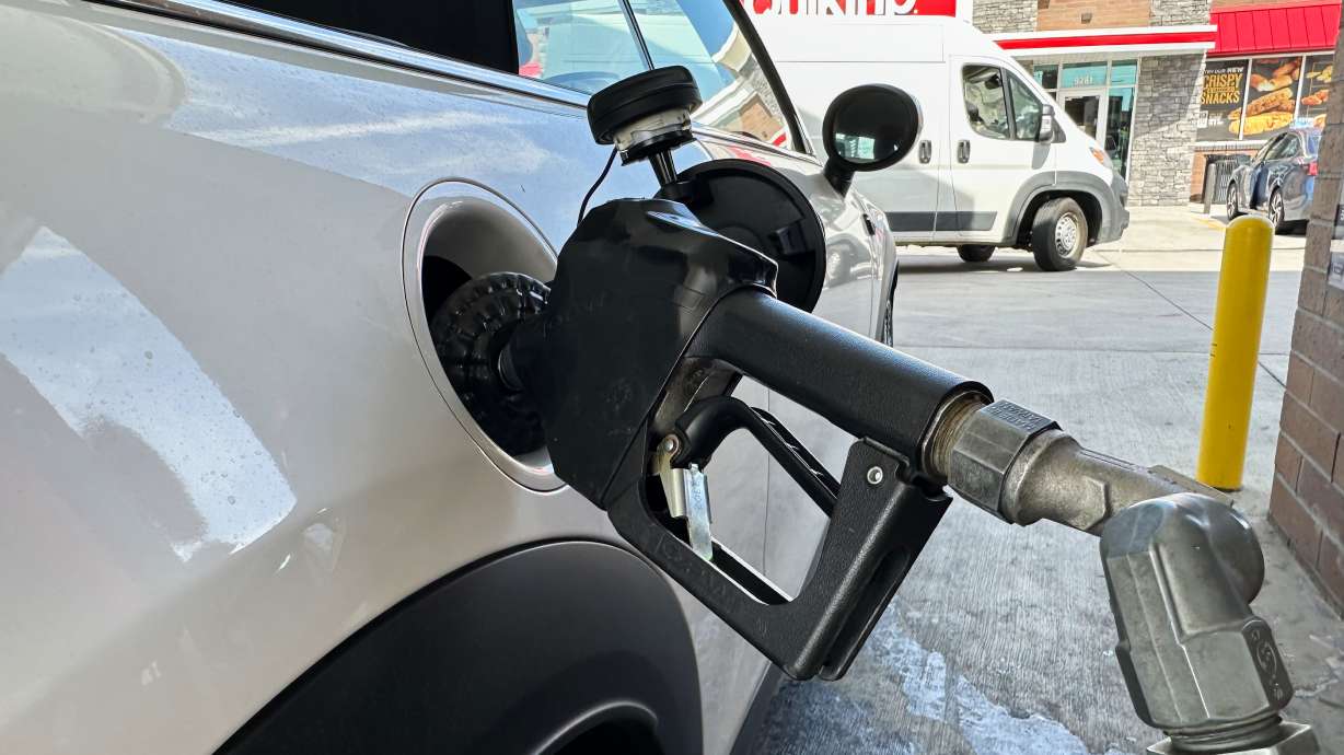 A motorist fills up the fuel tank of a vehicle at a QuikTrip gasoline stop, Sept. 15, in Greenwood Village, Colo. Americans' confidence in the economy sank to the lowest level in more than a decade this month as prices remain elevated and wages stagnate amid the ongoing Iran war.